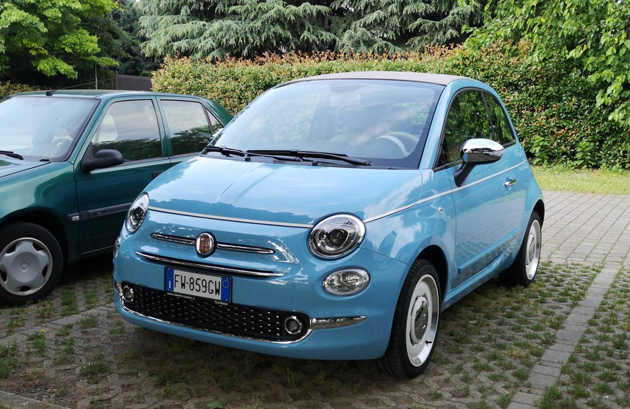 Light blue Fiat 500 with white rims