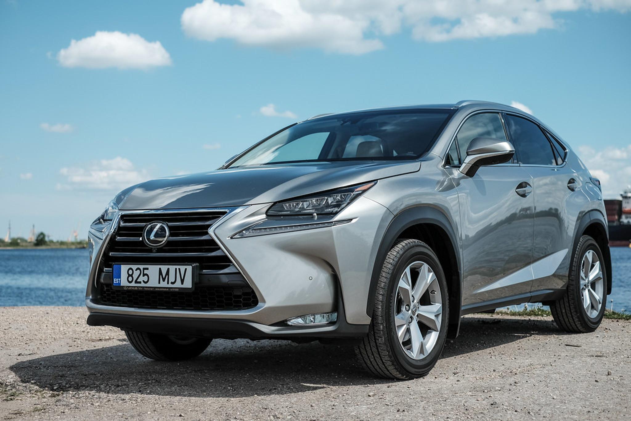 Grey Lexus NX Hybrid next to an ocean