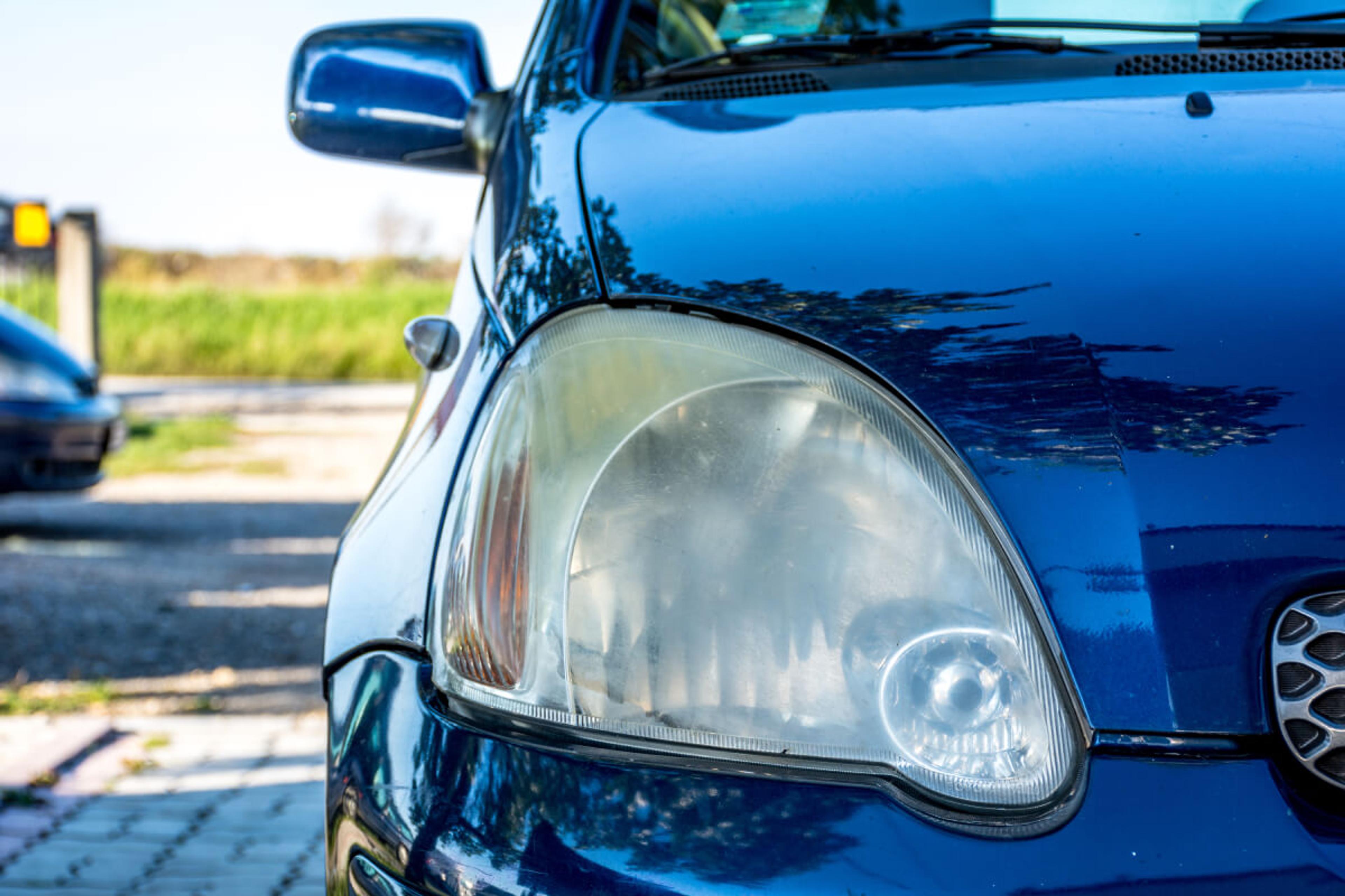 foggy headlights on blue car