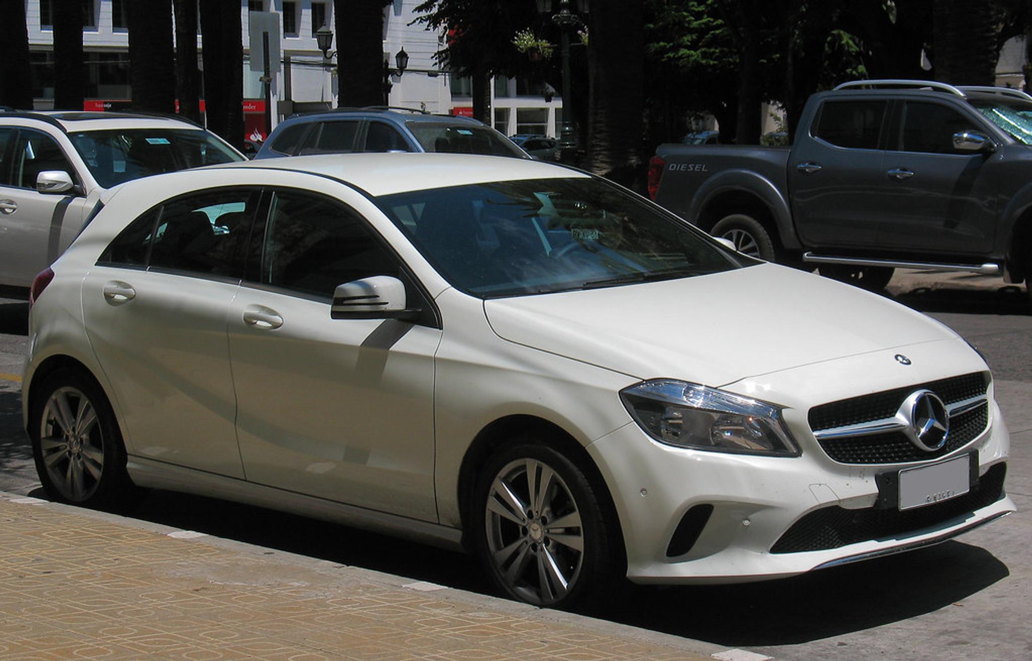 White Mercedes-Benz A Class parked by the side of the road
