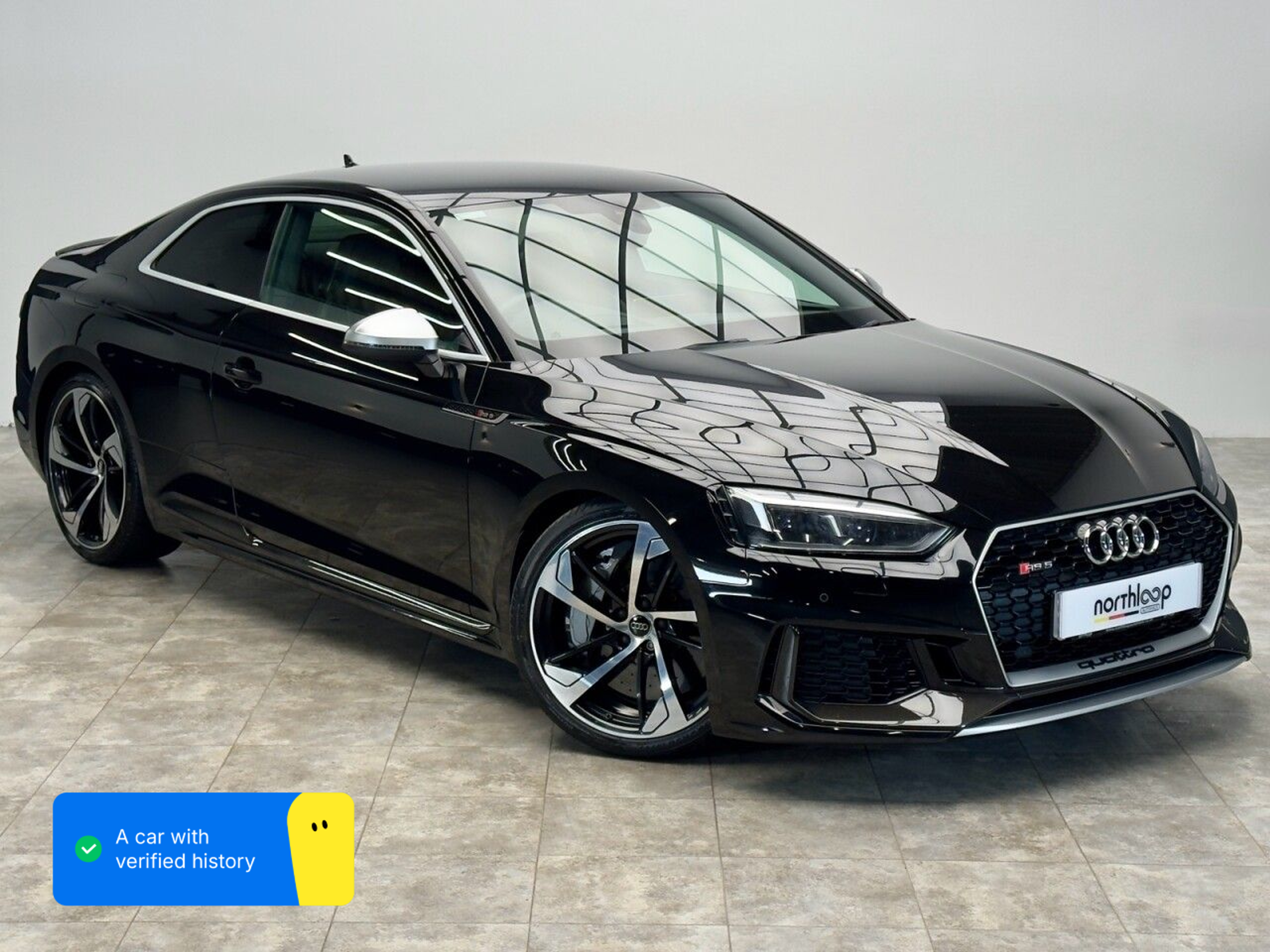Black Audi RS5 at North Loop Autohaus dealership