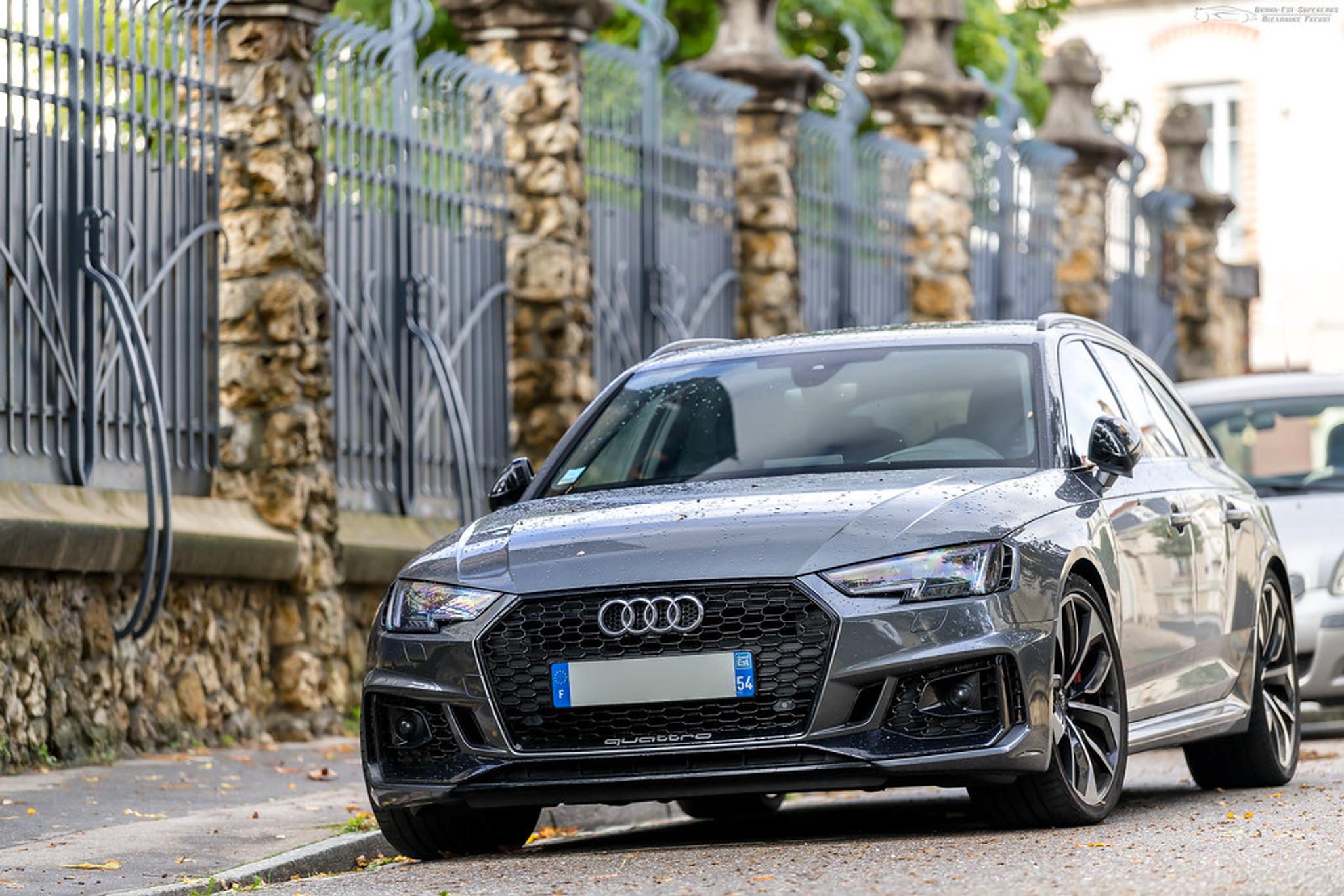 Grey Audi RS4 parked on the side of the road