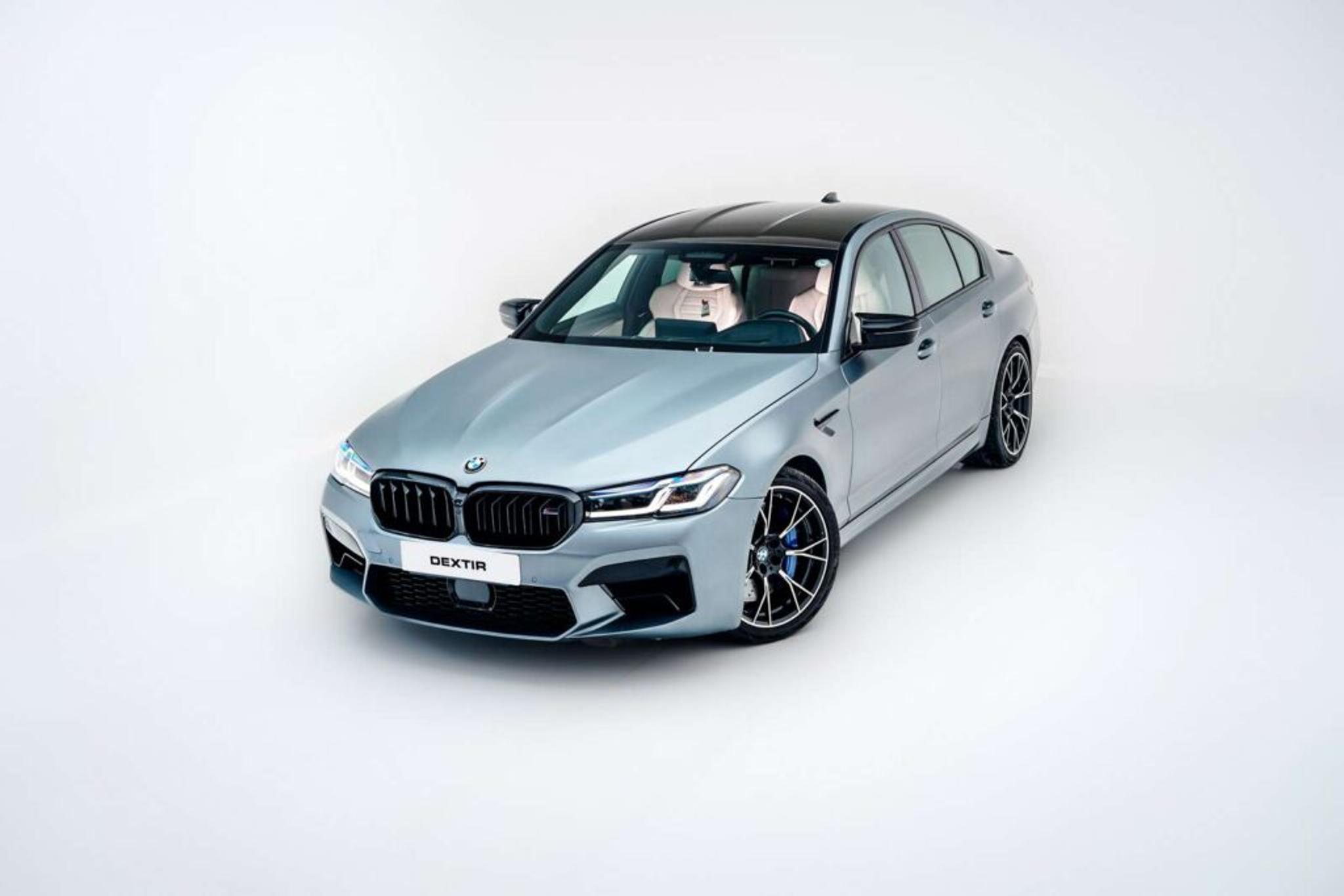 Grey BMW 5 series with titan disks