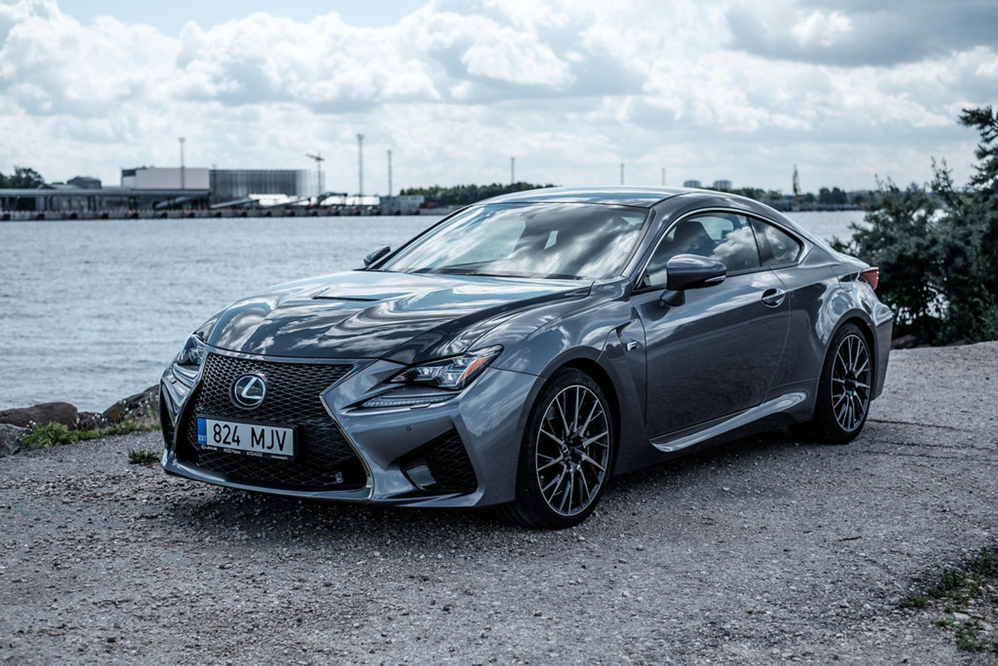 Dark grey Lexus RC next to the ocean