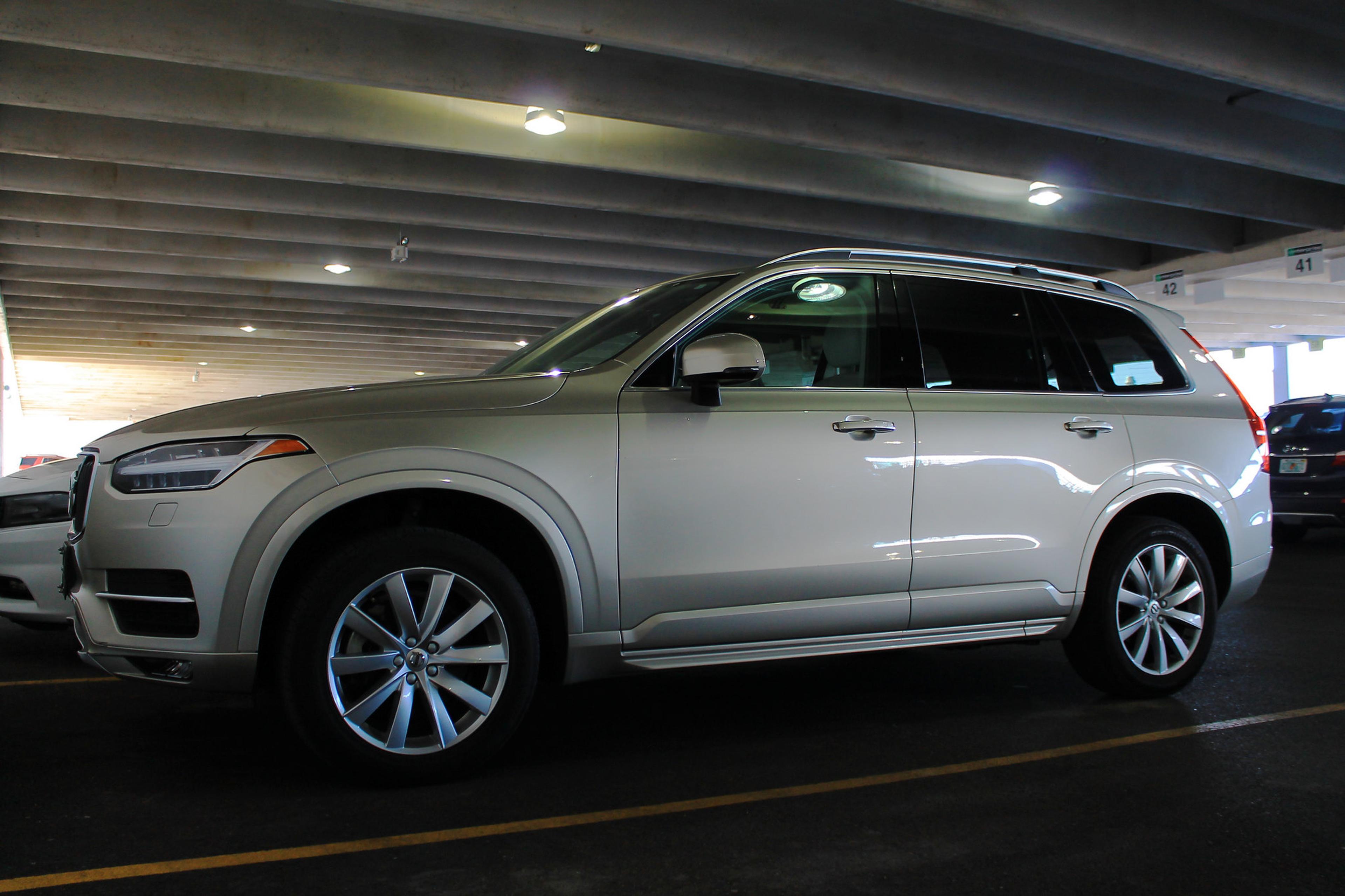 A grey Volvo xc90 in a car park