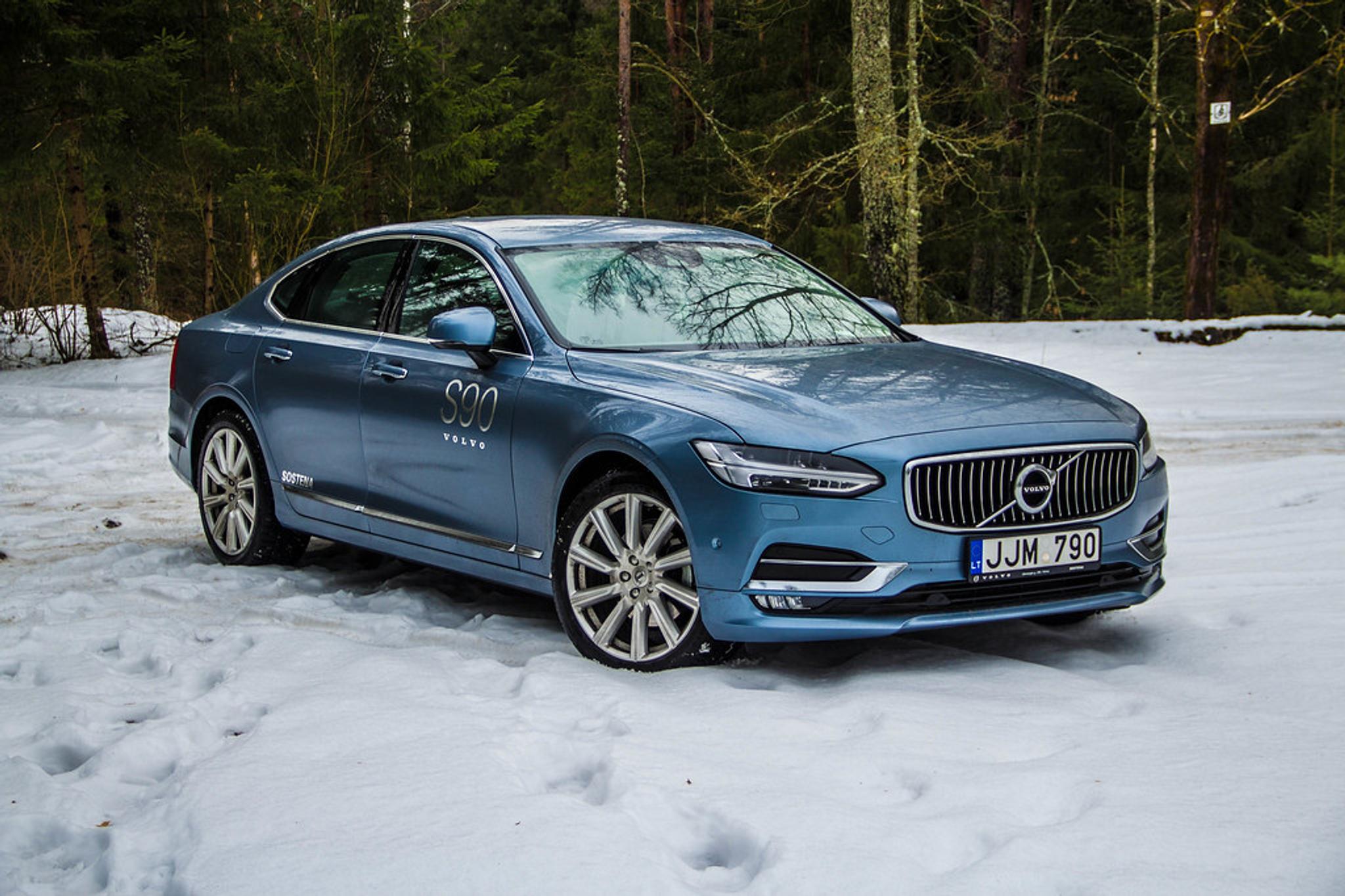 Blue Volvo S90 on the snow
