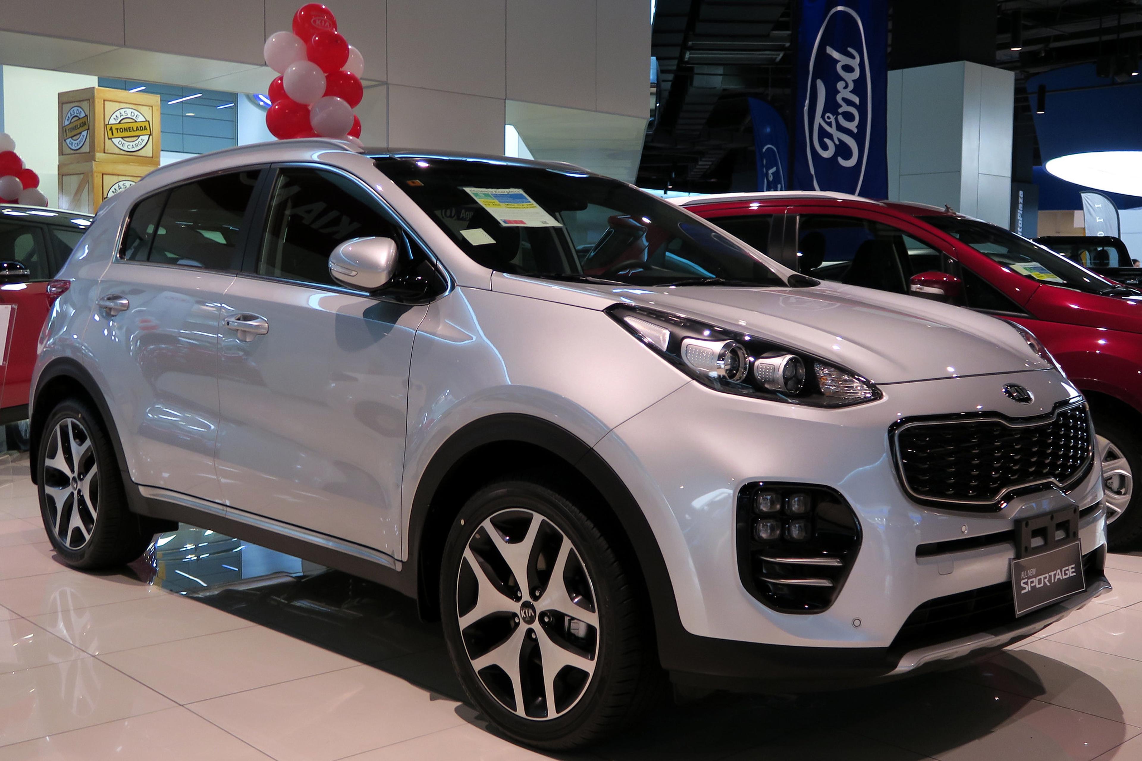 A grey Kia Sportage in a dealership  