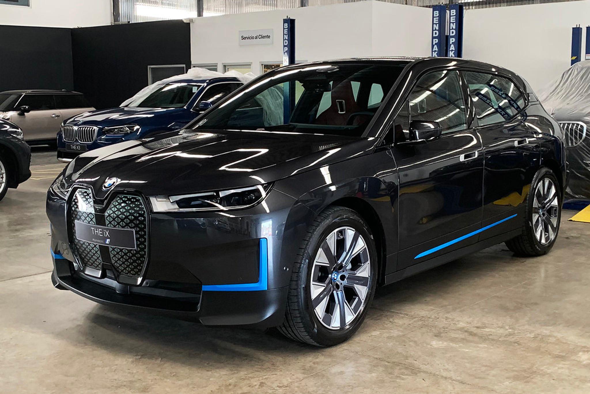 Dark grey BMW iX with blue accents