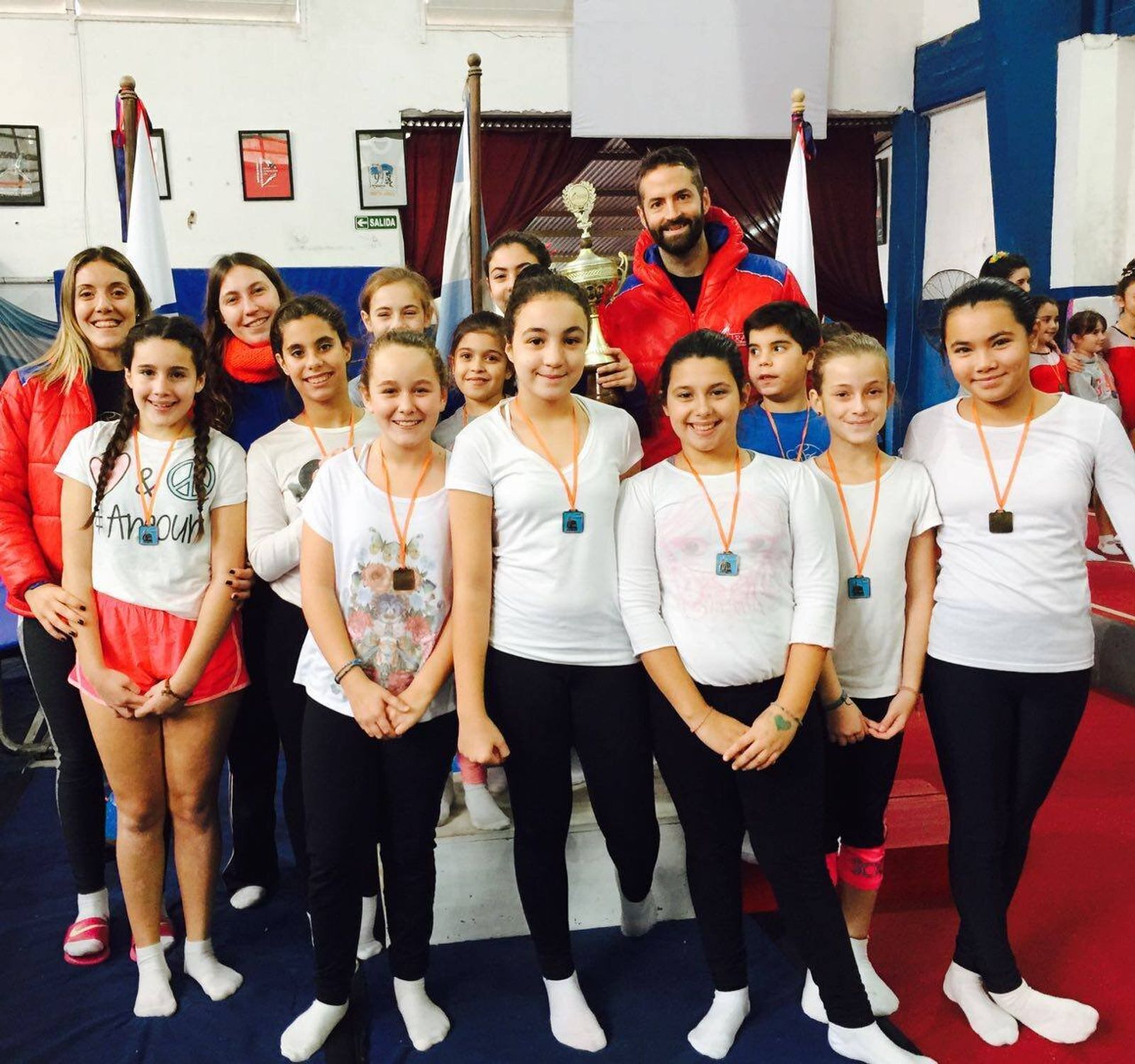 Pedro Pitton with a crew of young gymnasts