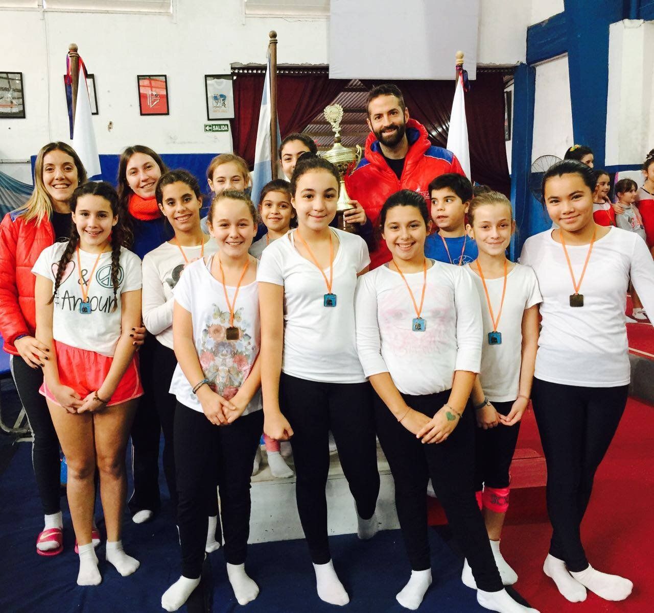 Pedro Pitton with a crew of young gymnasts