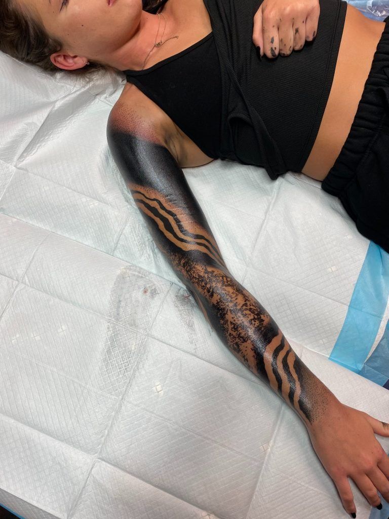 “Blackout is definitely a different experience than a ‘normal’ tattoo, it’s no breaks and solid tattooing and saturation. Even people who are heavily tattooed are surprised how different it is,” interview with tattoo artist Teej
