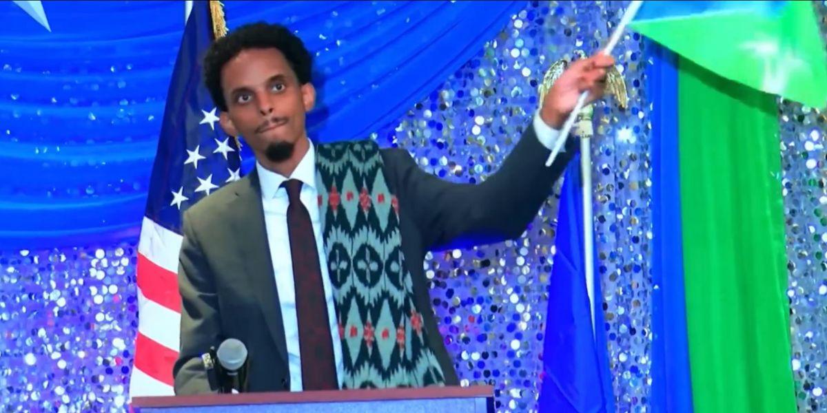 Socialist Minneapolis mayoral candidate Omar Fateh waves Somali flag at rally