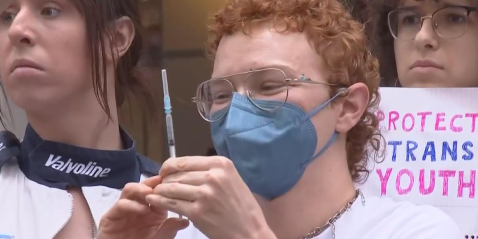 Trans activists shoot themselves up with hormones outside NYU Langone to protest hospital's end of child sex change services