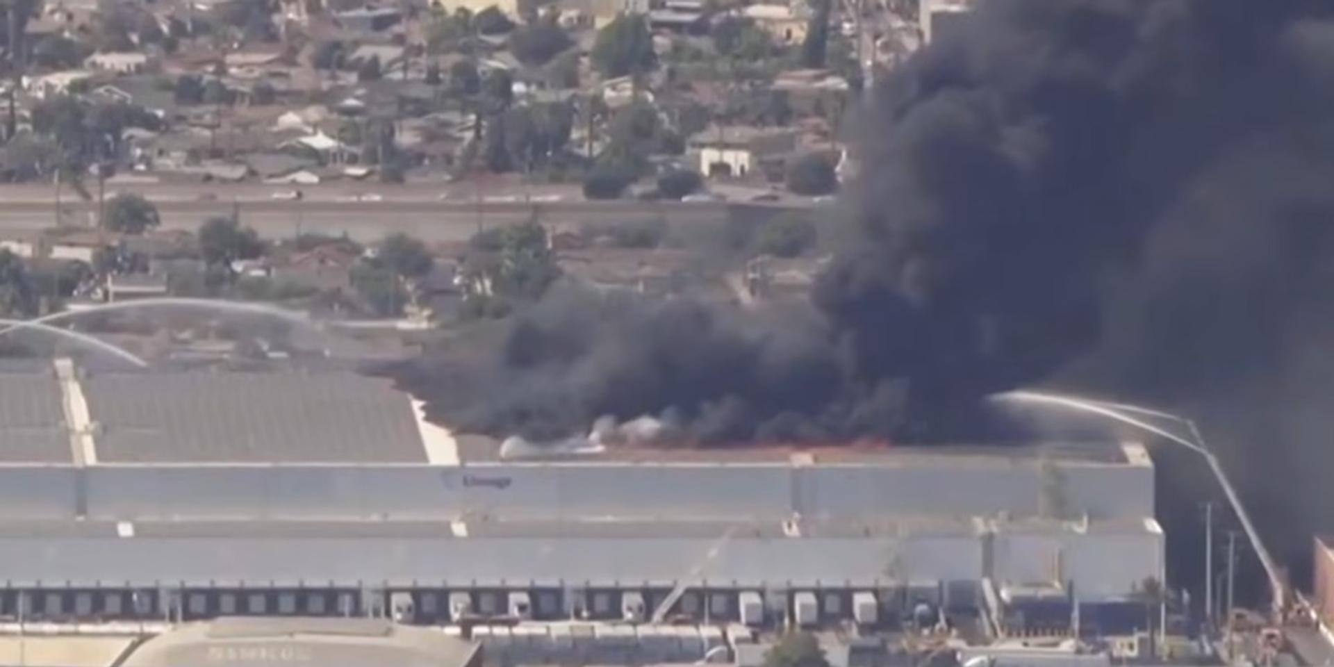 Massive warehouse fire continues to rage in LA, company says blaze began in rooftop solar array