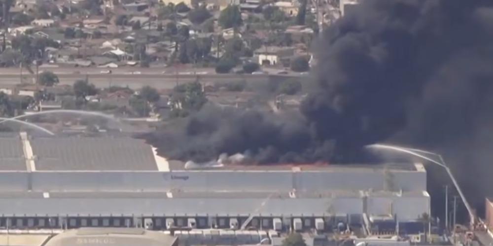 Massive warehouse fire continues to rage in LA, company says blaze began in rooftop solar array