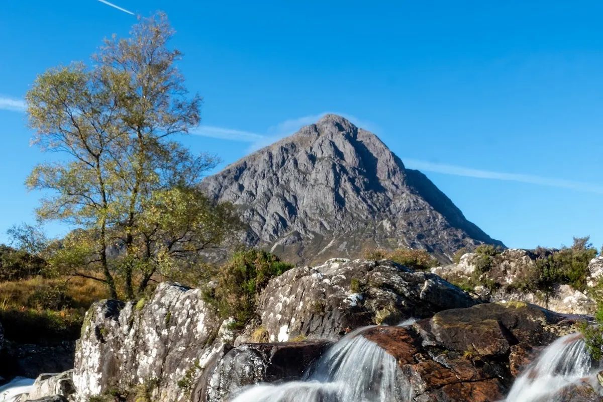 Waterfall at the base of Buachaille Etive Mor in Glencoe — Scotland's most iconic mountain photography location
