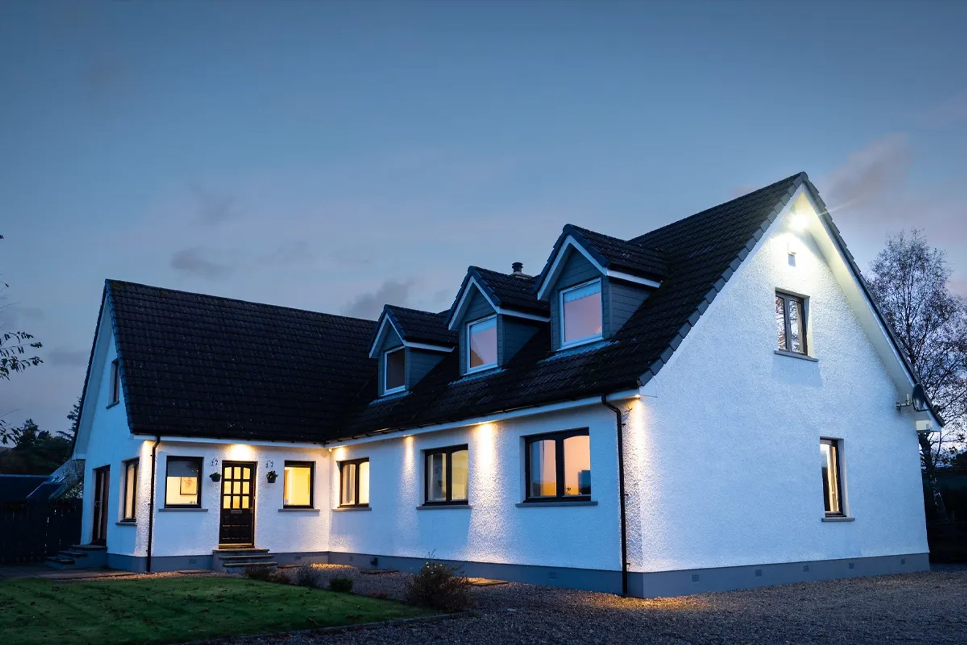 Highwinds Lodge at dusk dog friendly luxury accommodation at the foot of Ben Nevis, Fort William