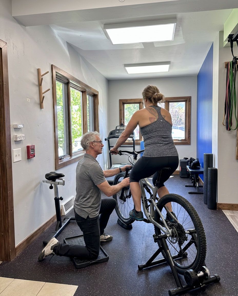Dr. Mackenzie assessing a patient during a one-on-one physical therapy session