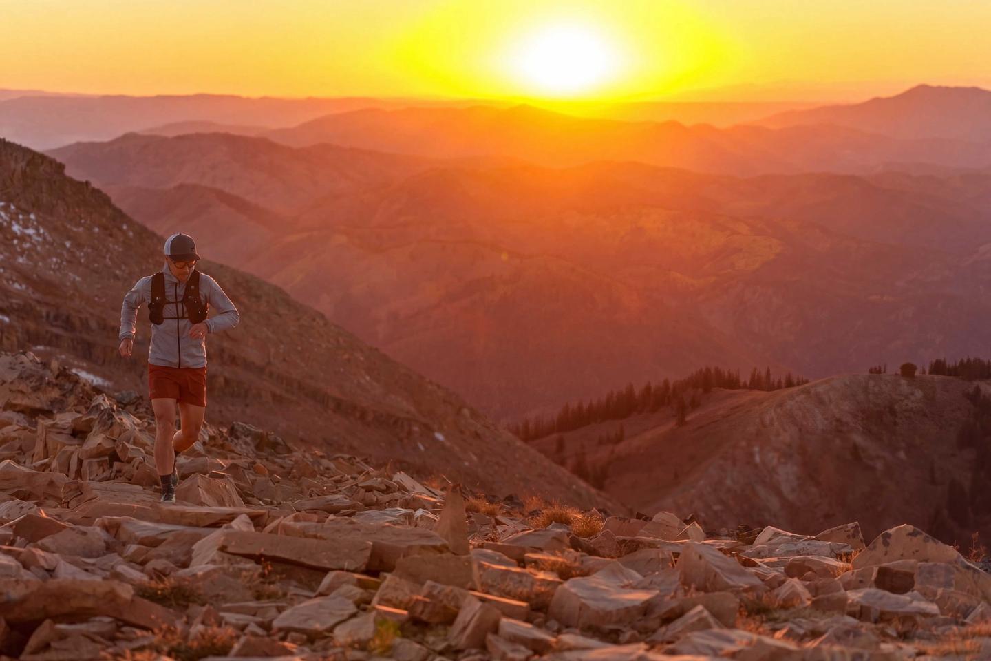 Trail runner on Mt. Taylor at sunrise in the Teton Mountains