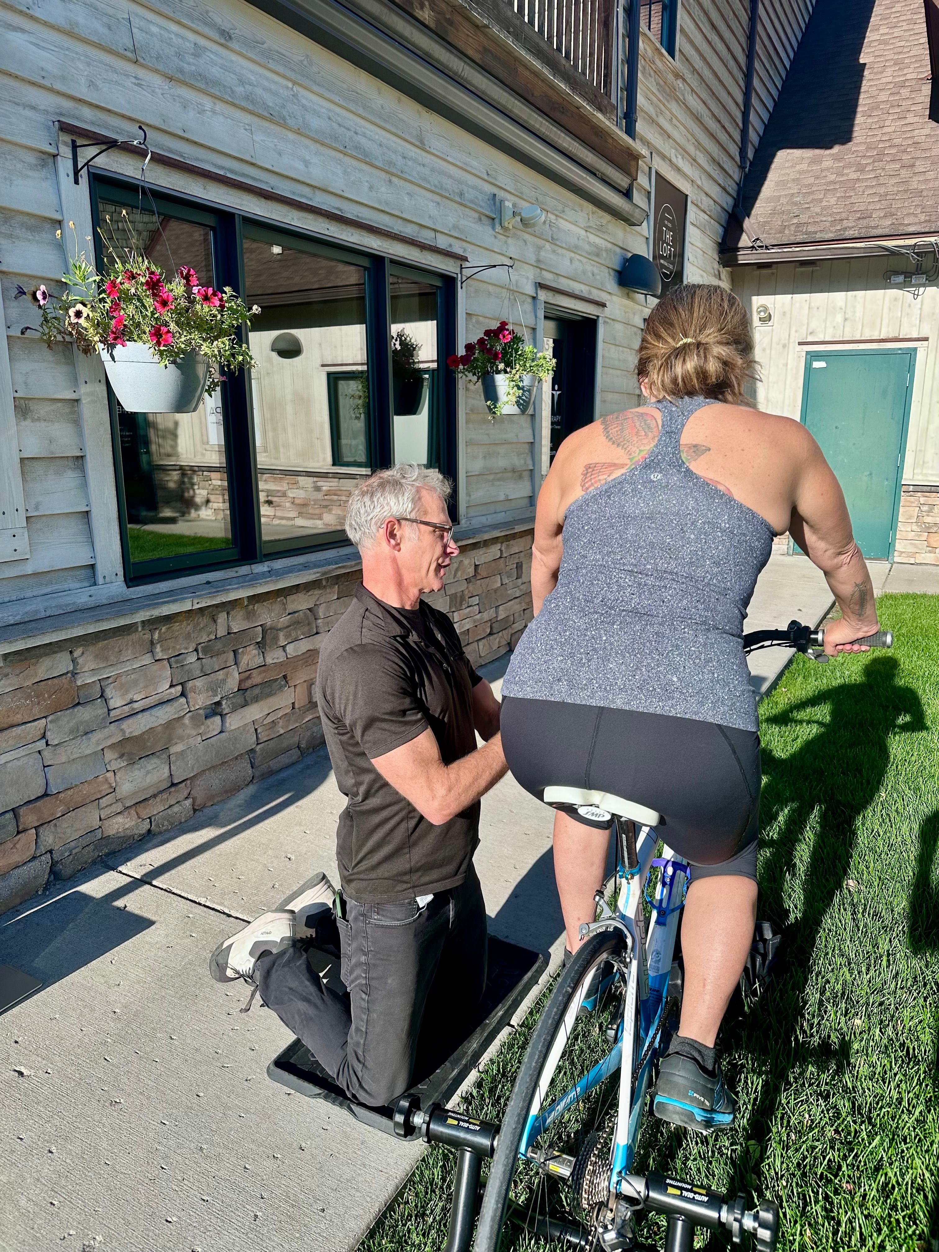Dr. Freckleton performing a bike fit at W.E.S.T. Physical Therapy
