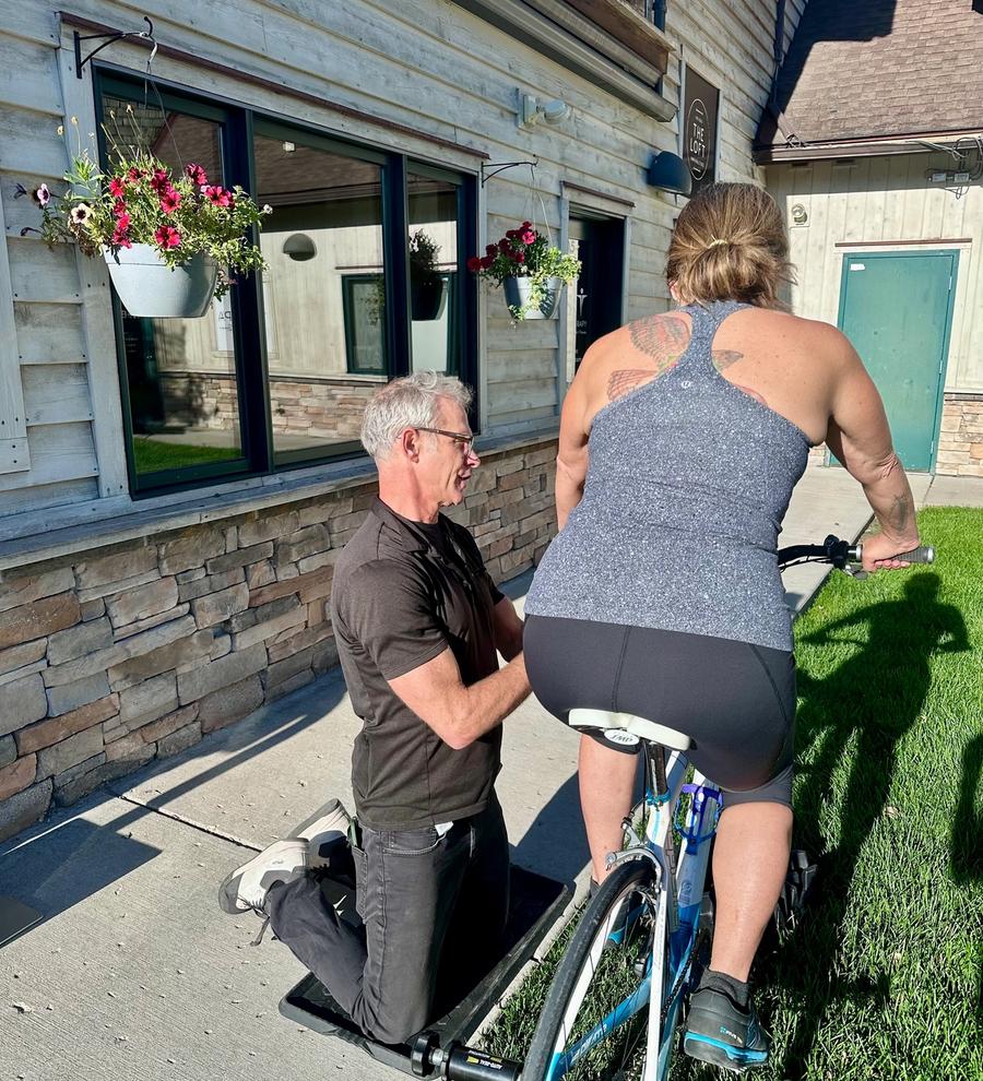 Dr. Freckleton performing a bike fit at W.E.S.T. Physical Therapy