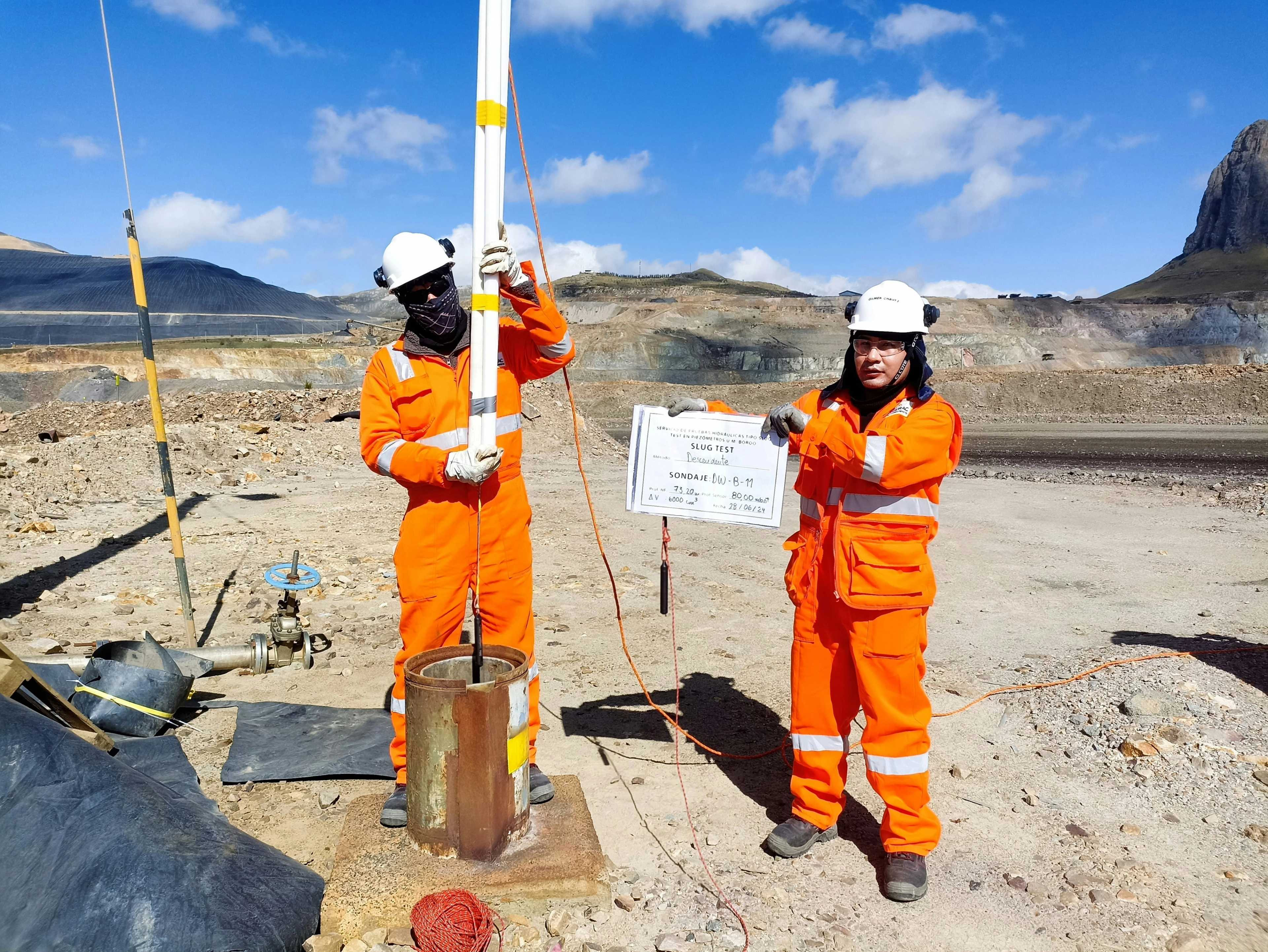 Site engineers in hard hats and high-visibility clothing during a ground investigation