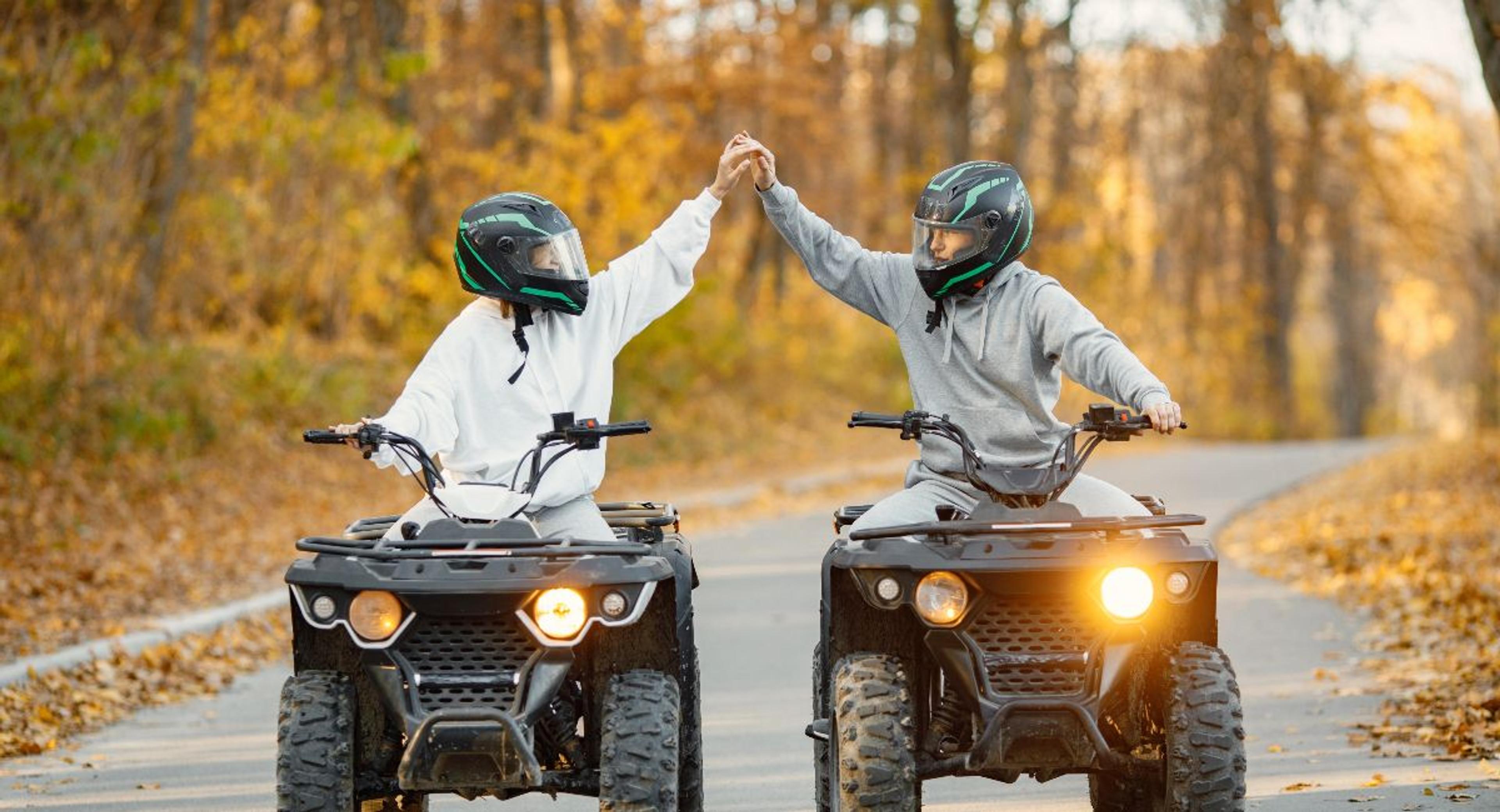 A couple riding an ATV 
