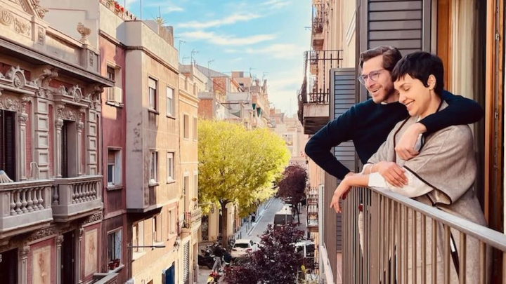 couple looking out from balcony