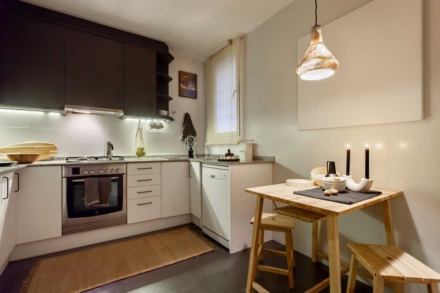 1653912591-ukio-barcelona-diagonal-big-kitchen-with-a-small-high-table-in-apartment.jpg