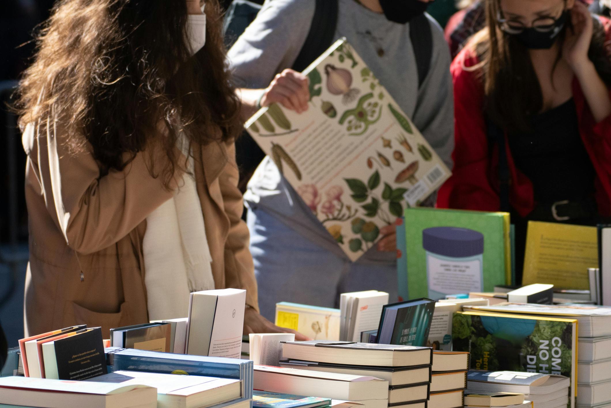 People at a book stall during Sant Jordi celebrations