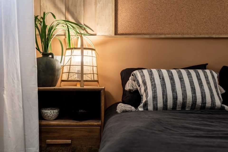 1653669689-bedside-table-with-plant.jpg