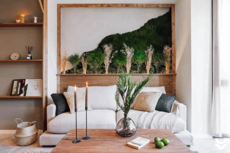 Couch and shelves in living room with mountain art on the wall behind
