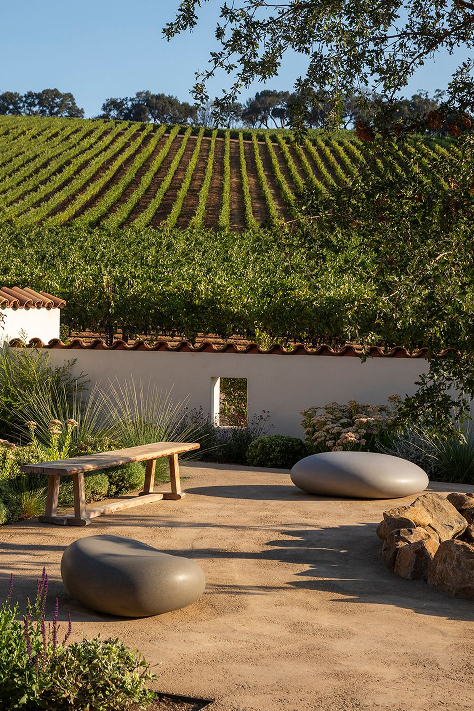 Soma Stones in a backyard with a vineyard view