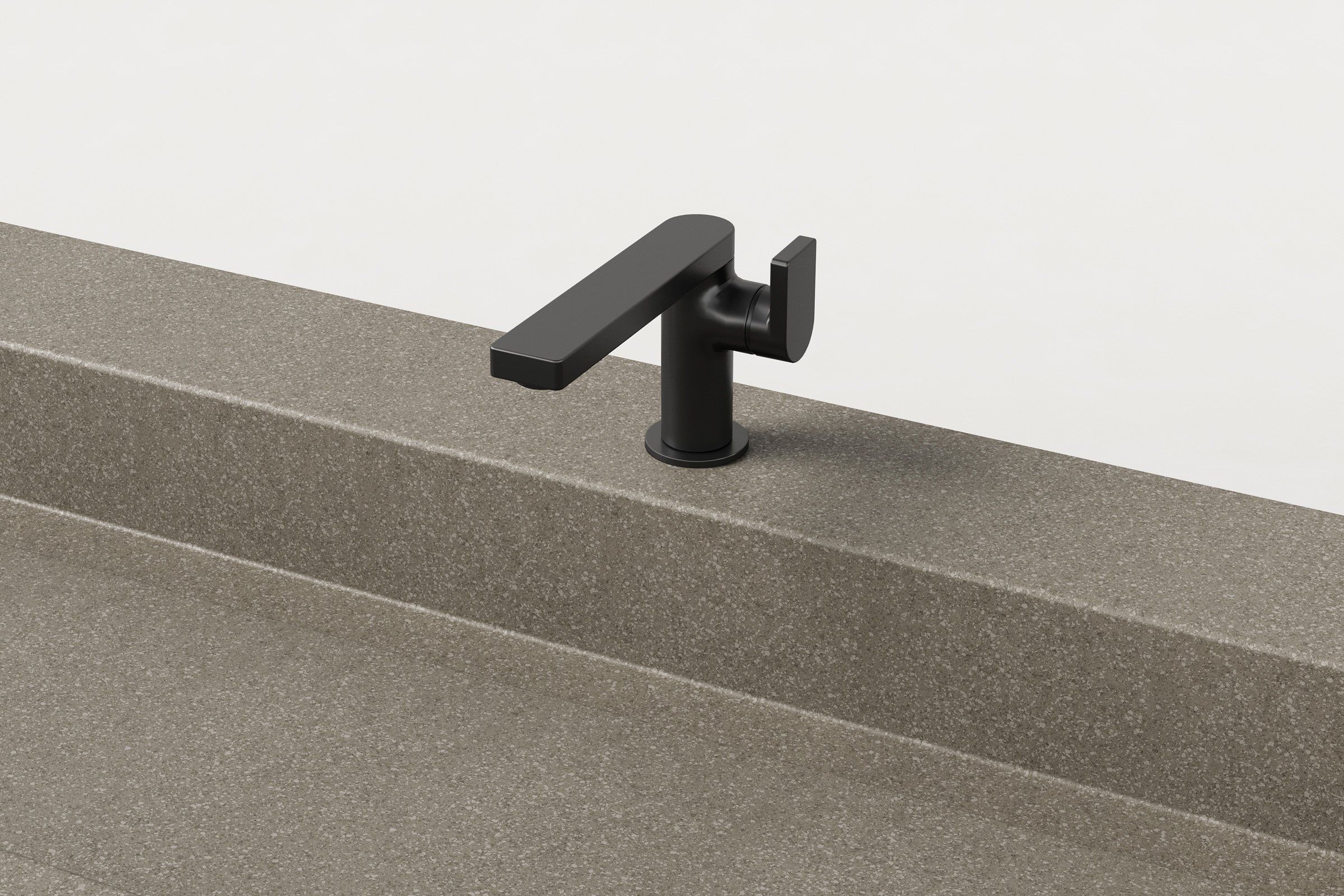 Close-up of matte black faucet installed on concrete sink in hurricane finish.
