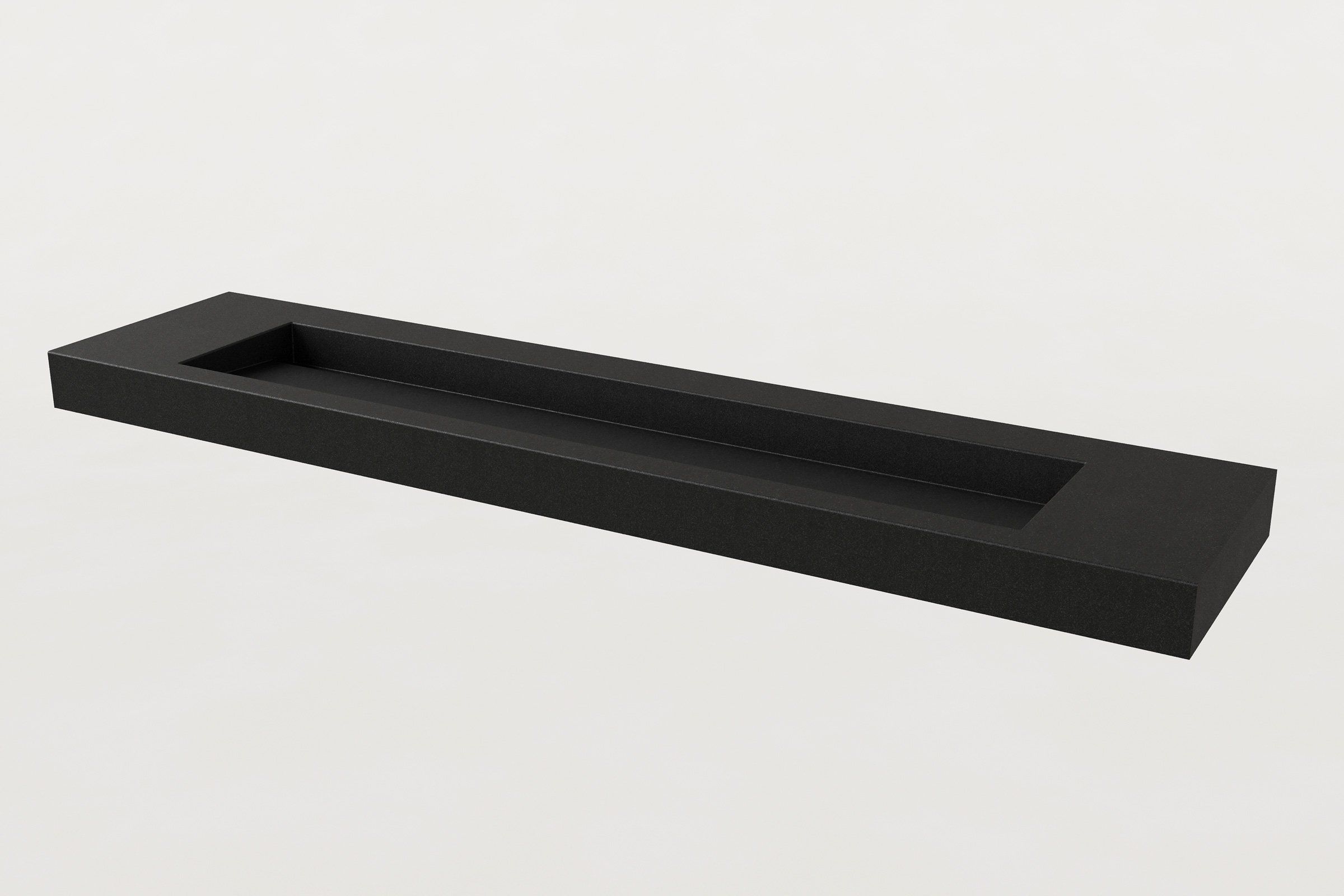 Black rectangular concrete trough sink with a single long basin, no faucets installed.