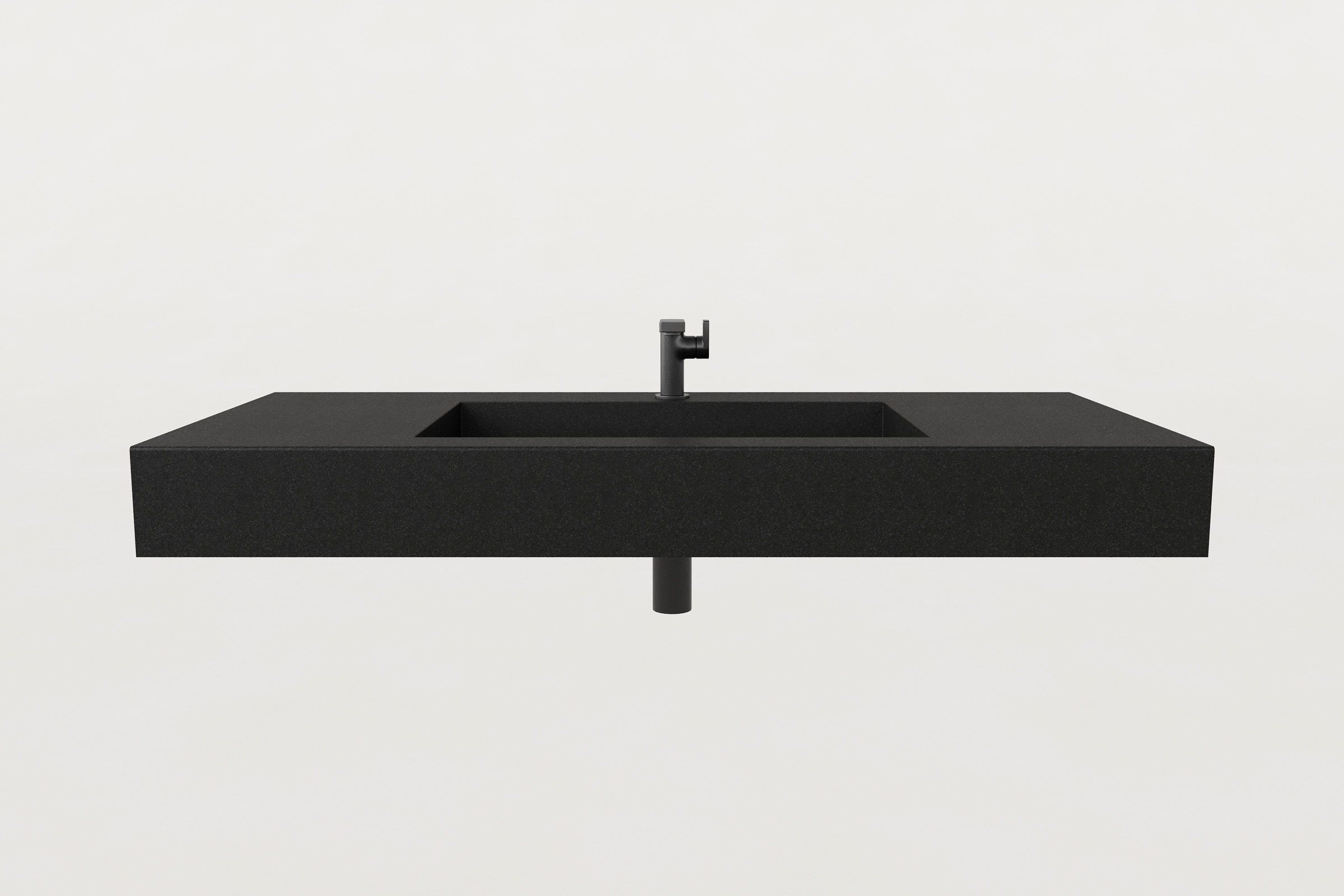 Front view of the Storm finish concrete sink basin with matte black faucet and exposed drain pipe.