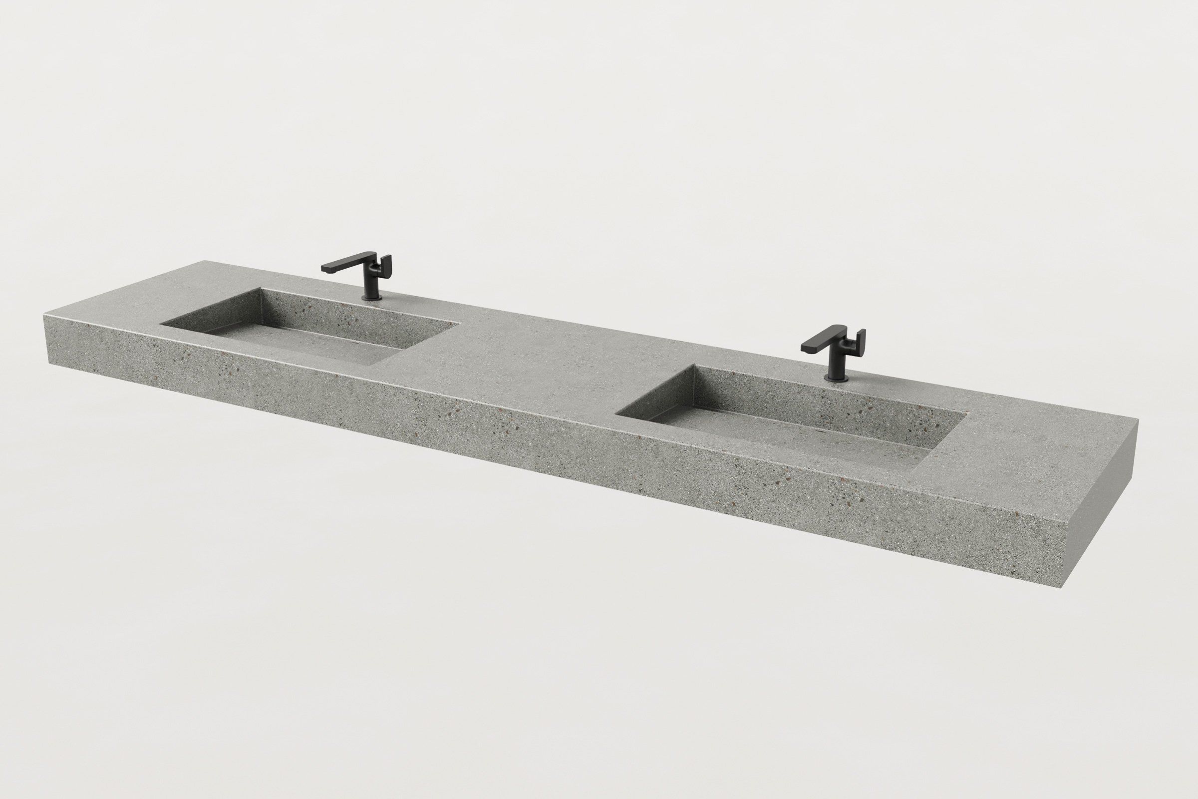 Concrete double-basin sink with two matte black faucets installed.