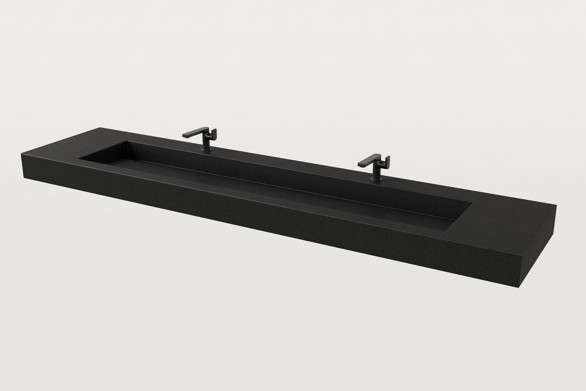 Black concrete trough sink with two matte black faucets installed above the basin.