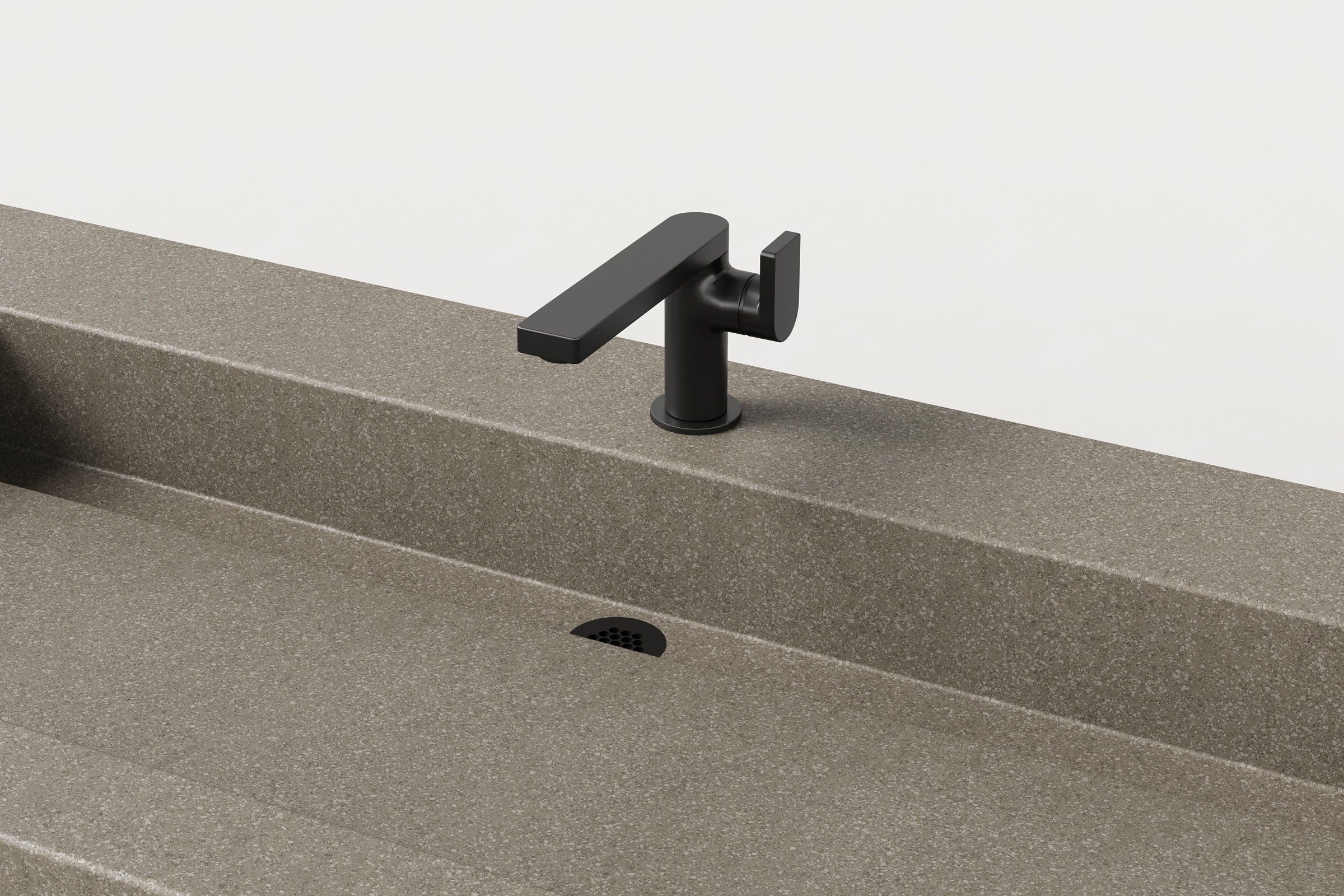 Close-up of Trof Drop 60 sink in Hurricane finish, showing matte black faucet, smooth basin surface, and integrated linear drain.