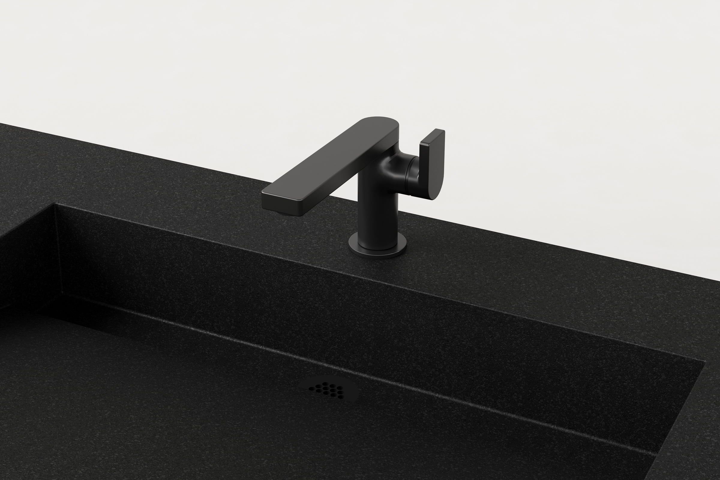 Close-up of black faucet and drain detail on Storm Trof sink.