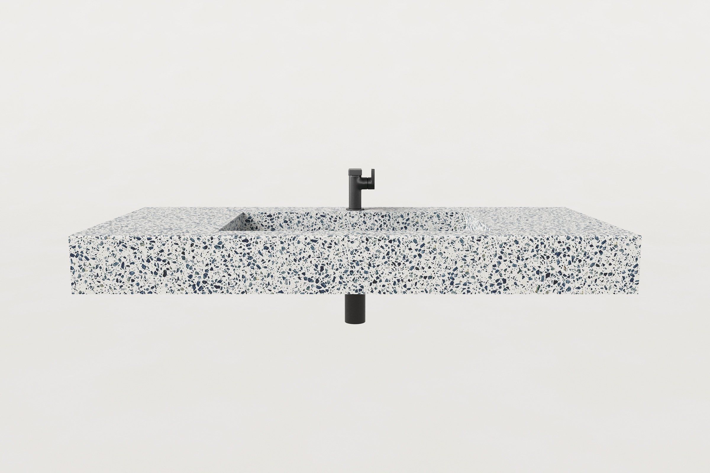 Front view of the Unazzo finish terrazzo sink basin with matte black faucet and exposed drain pipe.