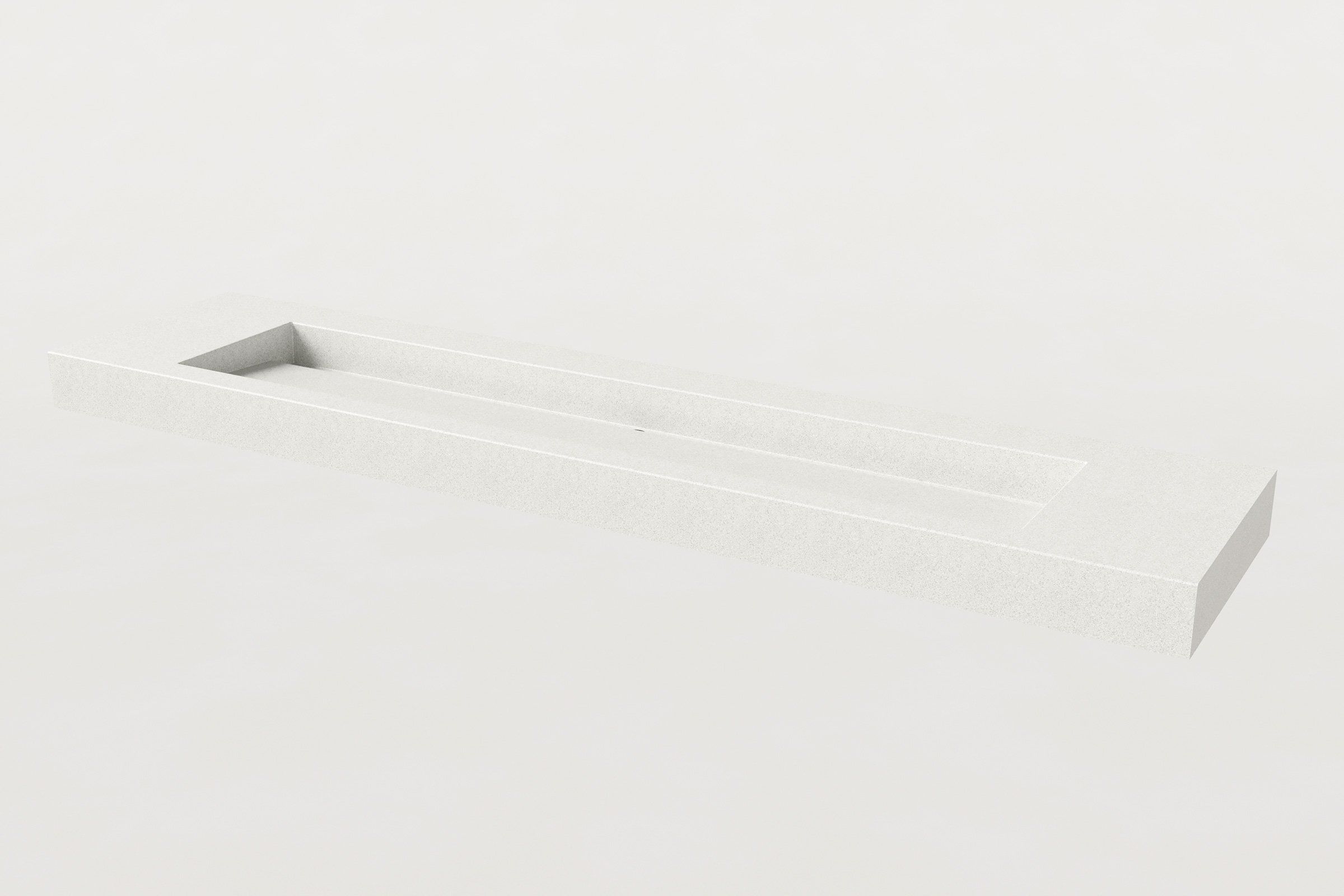 A minimalist white concrete sink with a single elongated rectangular basin, no faucets installed, against a plain background.