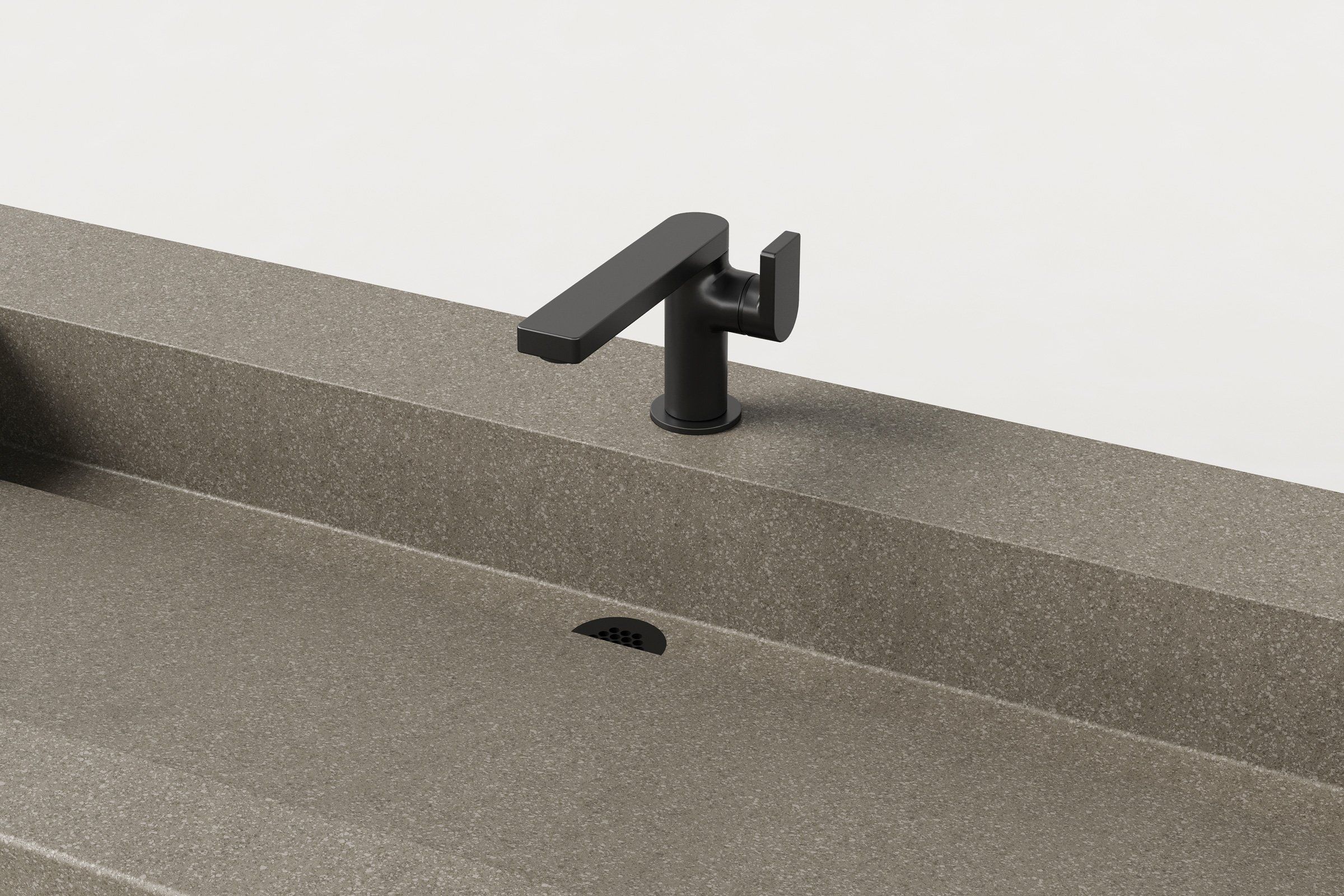 Close-up of the Hurricane sink’s faucet and drain, showing the texture of the concrete and clean lines of the integrated drain cover.