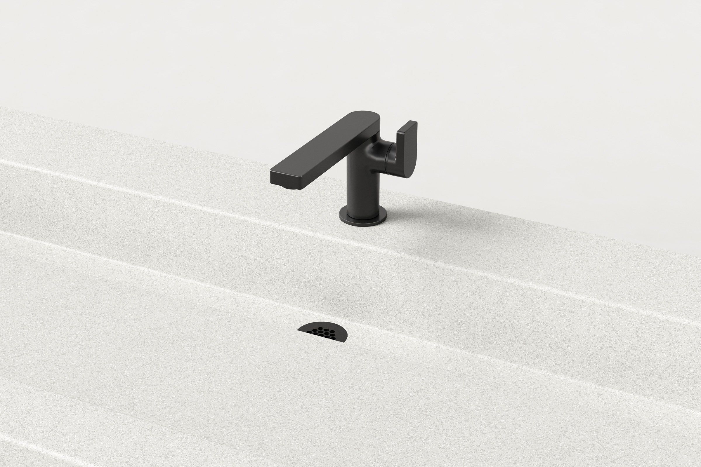 Close-up of Chalk finish sink showing matte black faucet and integrated drain.