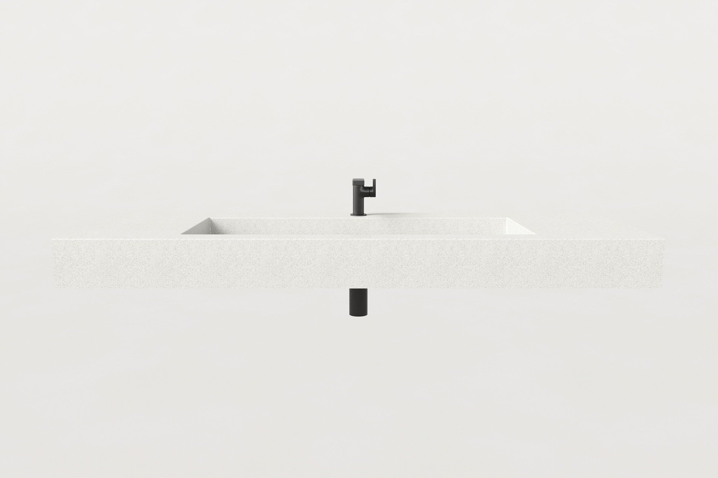 Close-up of the Trof Drop 60 Chalk sink by Manos, highlighting the smooth concrete surface, integrated trough basin, and matte black faucet detail.