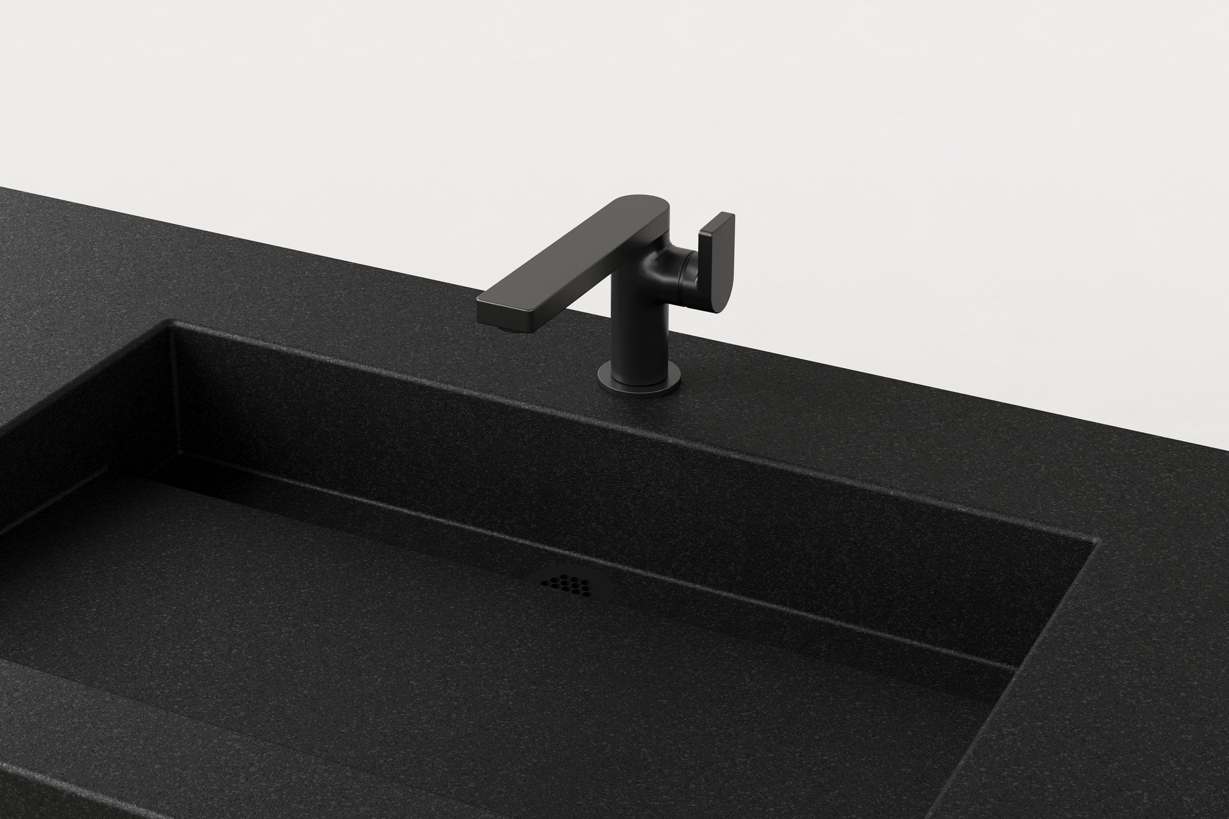 Detail view of Trof Drop 48 basin in Storm finish with matte black faucet and concealed linear drain.