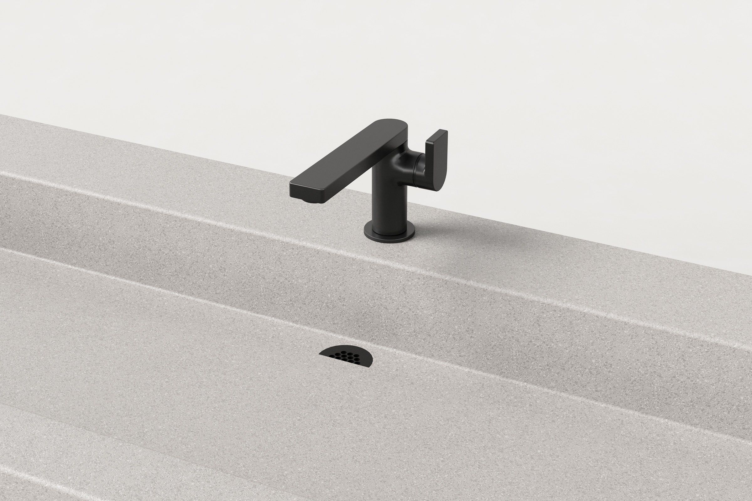 Close-up of Fog finish sink showing matte black faucet and integrated drain.