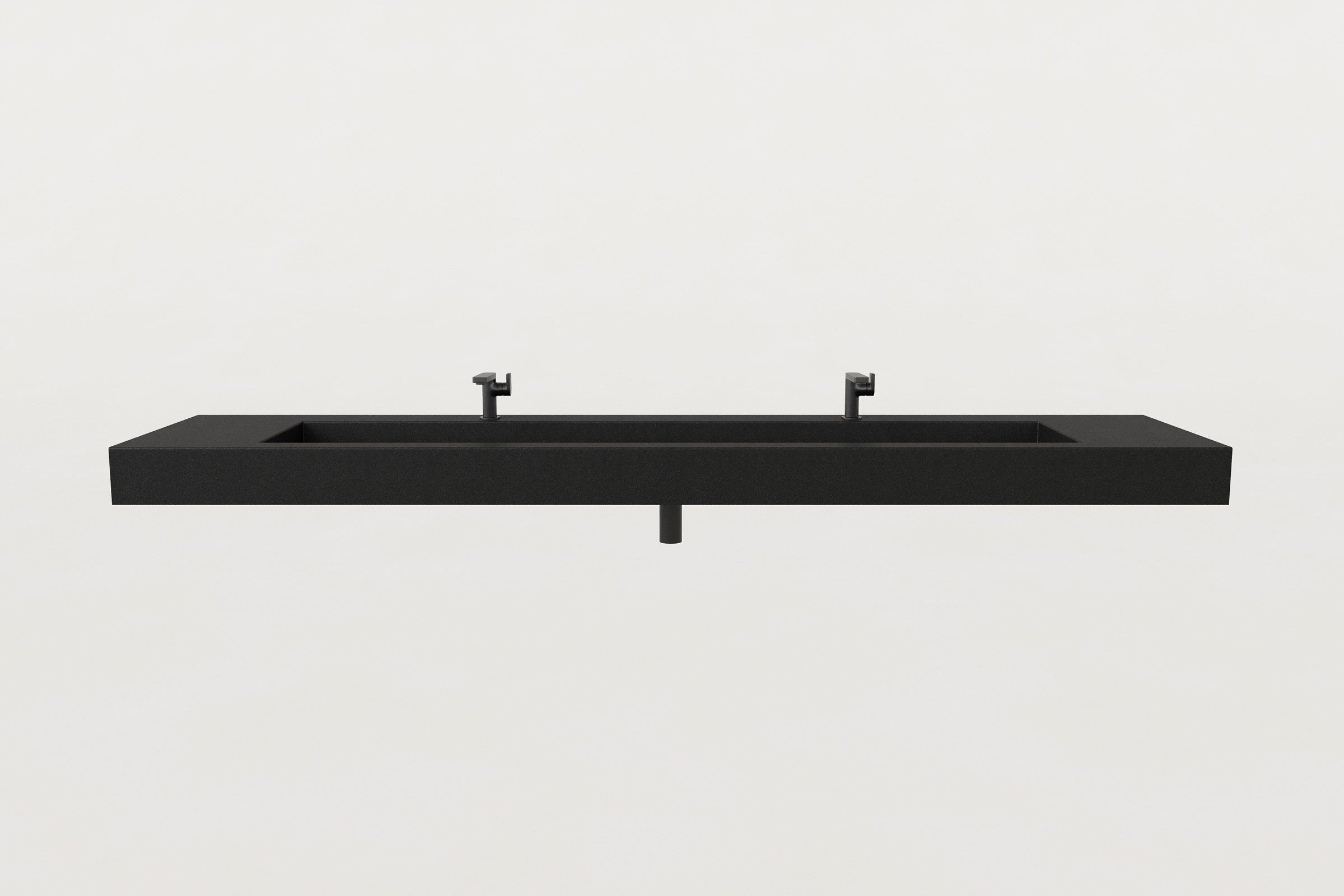 Front view of a black concrete trough sink with two matte black faucets and center drain outlet.