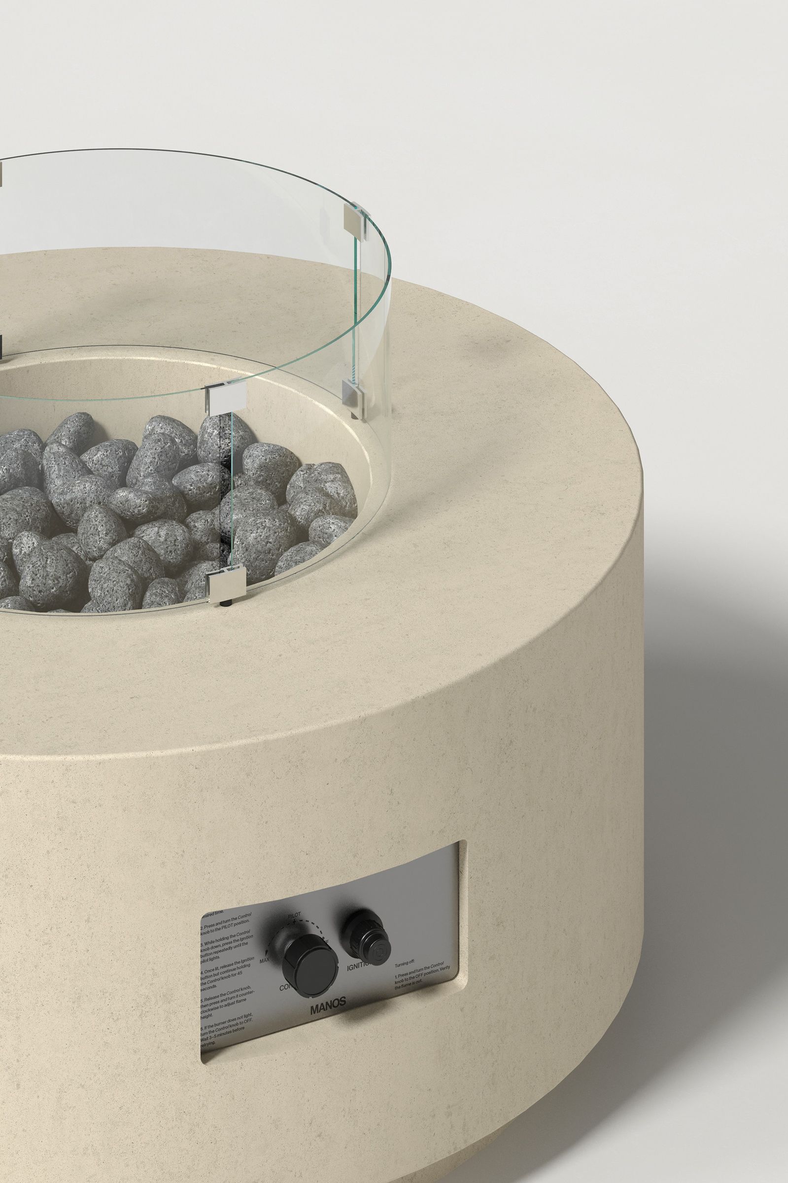 Close-up photograph of a sand-colored concrete fire pit with thick walls, showing the circular well with volcanic rocks, glass shield hardware, and integrated control panel.