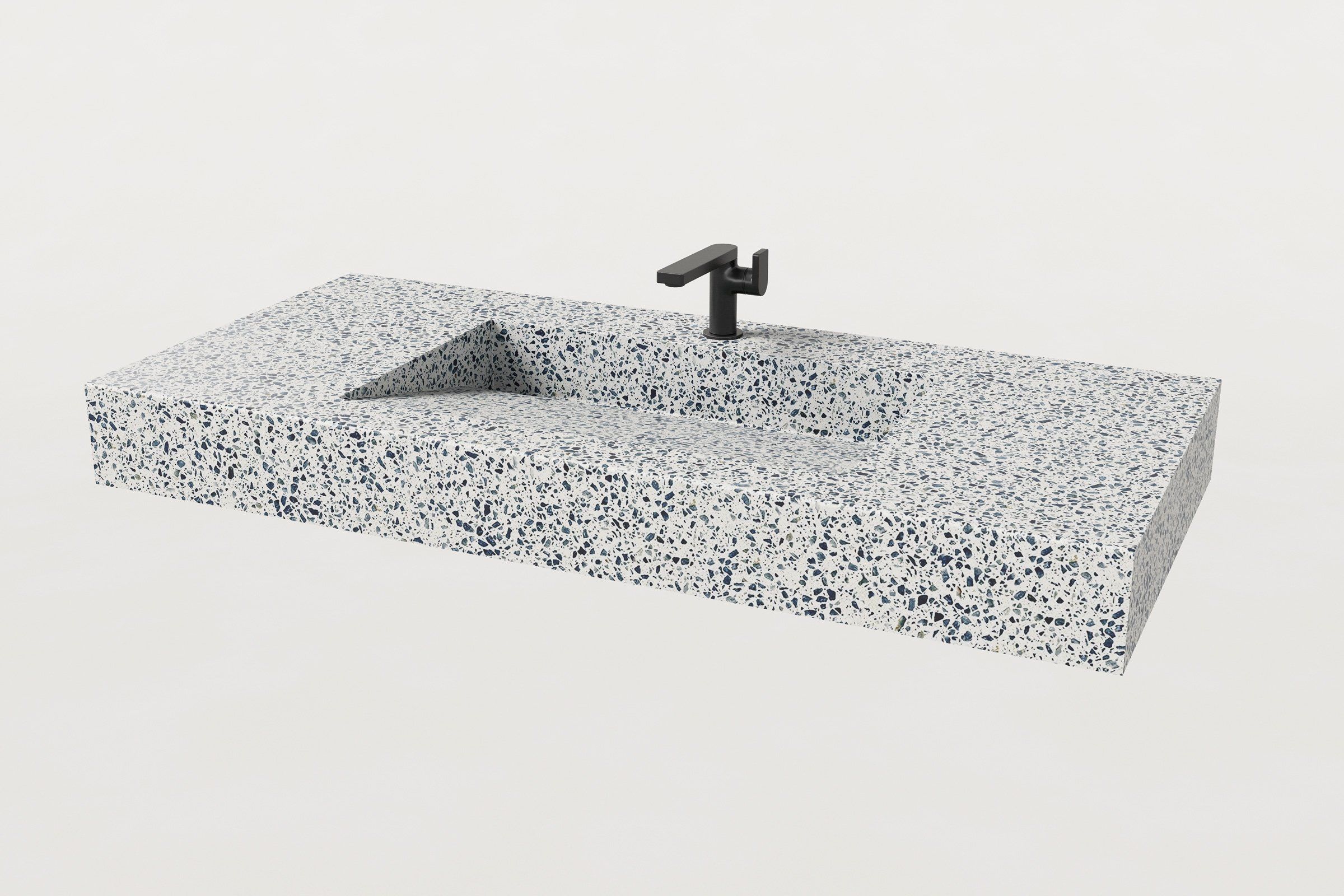 Rectangular terrazzo sink basin in Unazzo finish, shown with a matte black faucet.